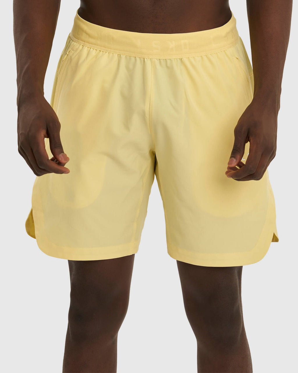 Model wearing Competition 8" Performance Short - Banana Smoothie