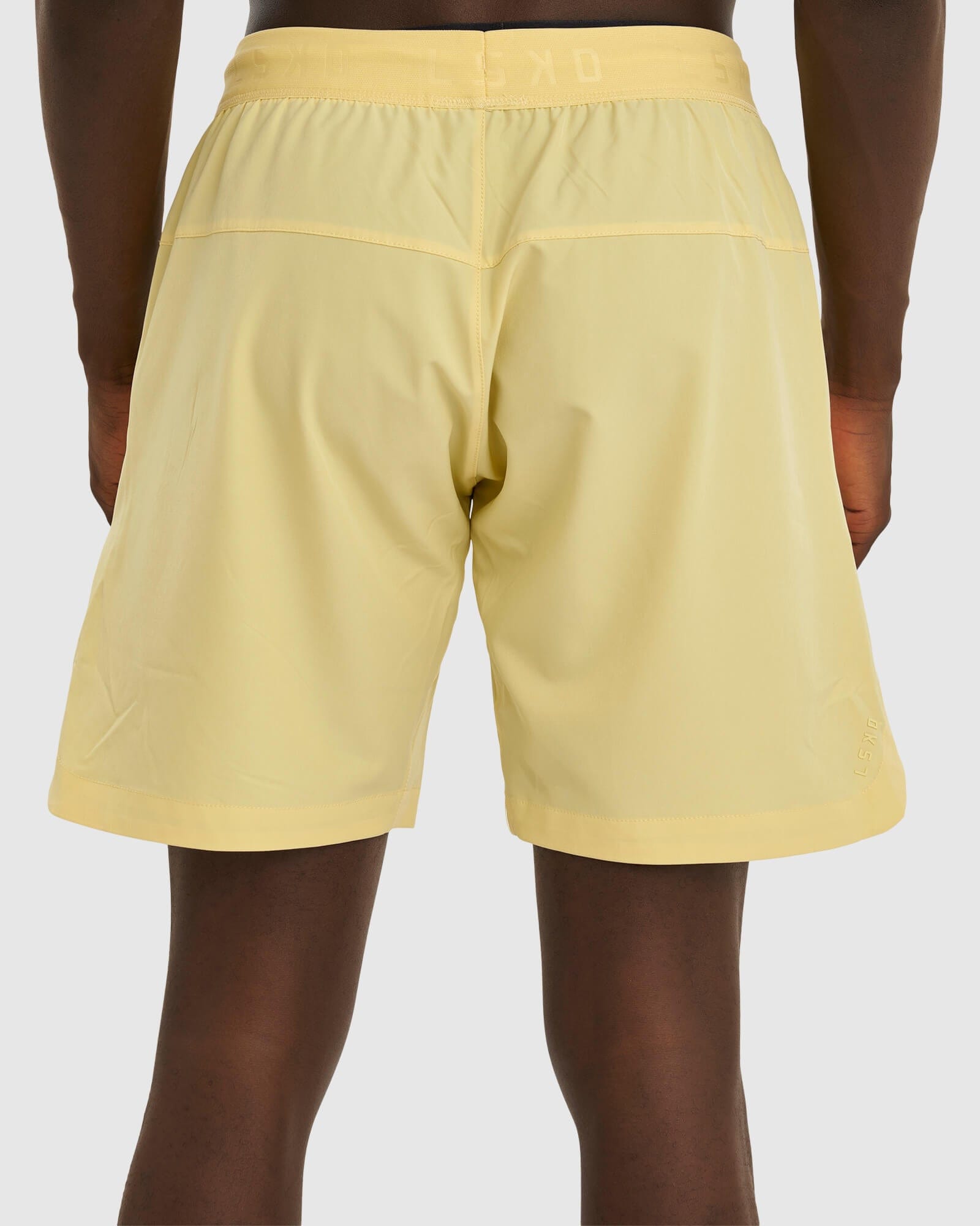 Model wearing Competition 8" Performance Short - Banana Smoothie