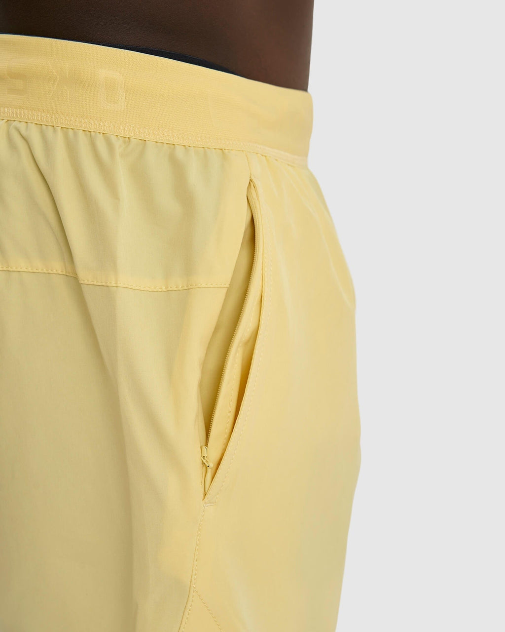 Model wearing Competition 8" Performance Short - Banana Smoothie