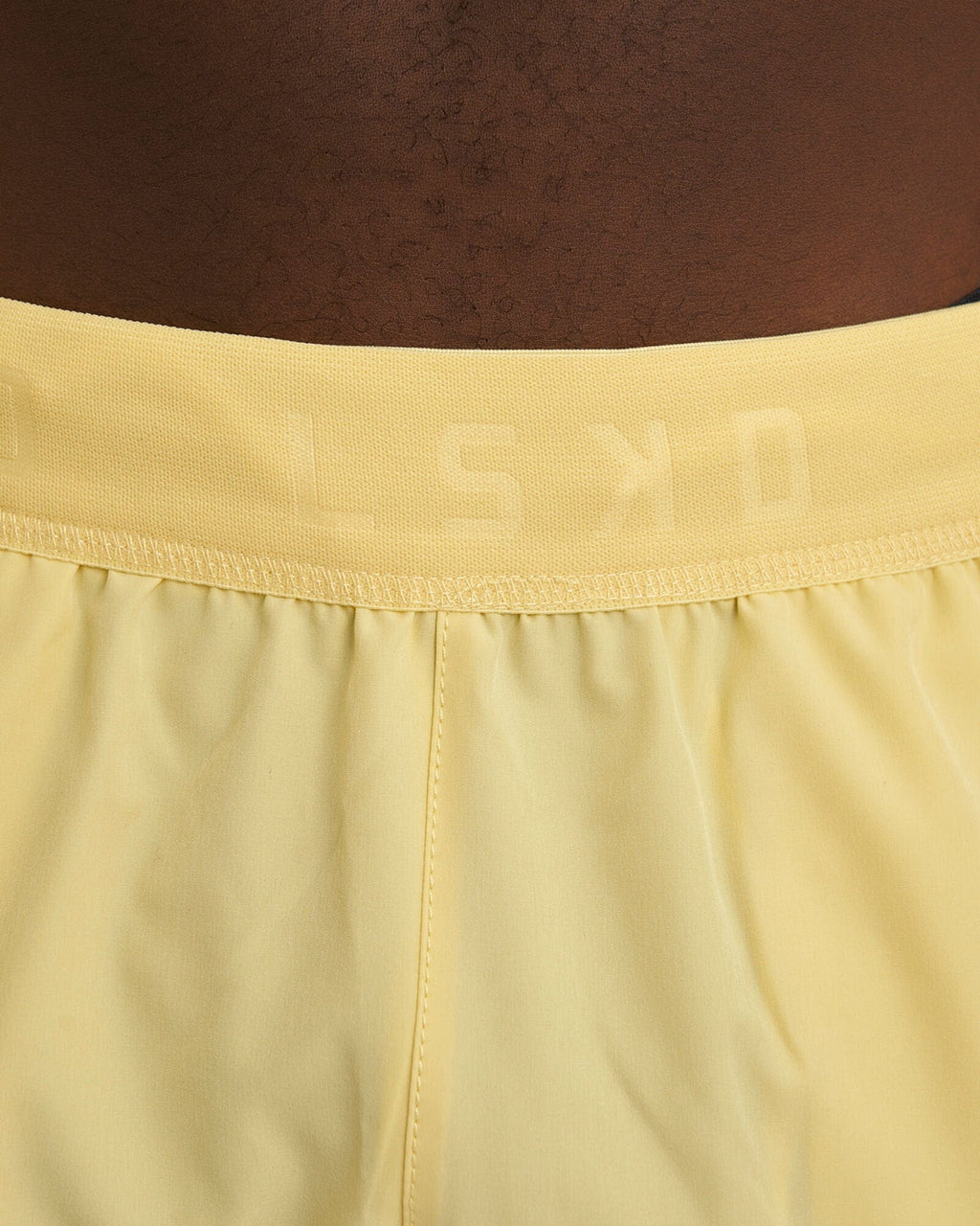 Model wearing Competition 8" Performance Short - Banana Smoothie