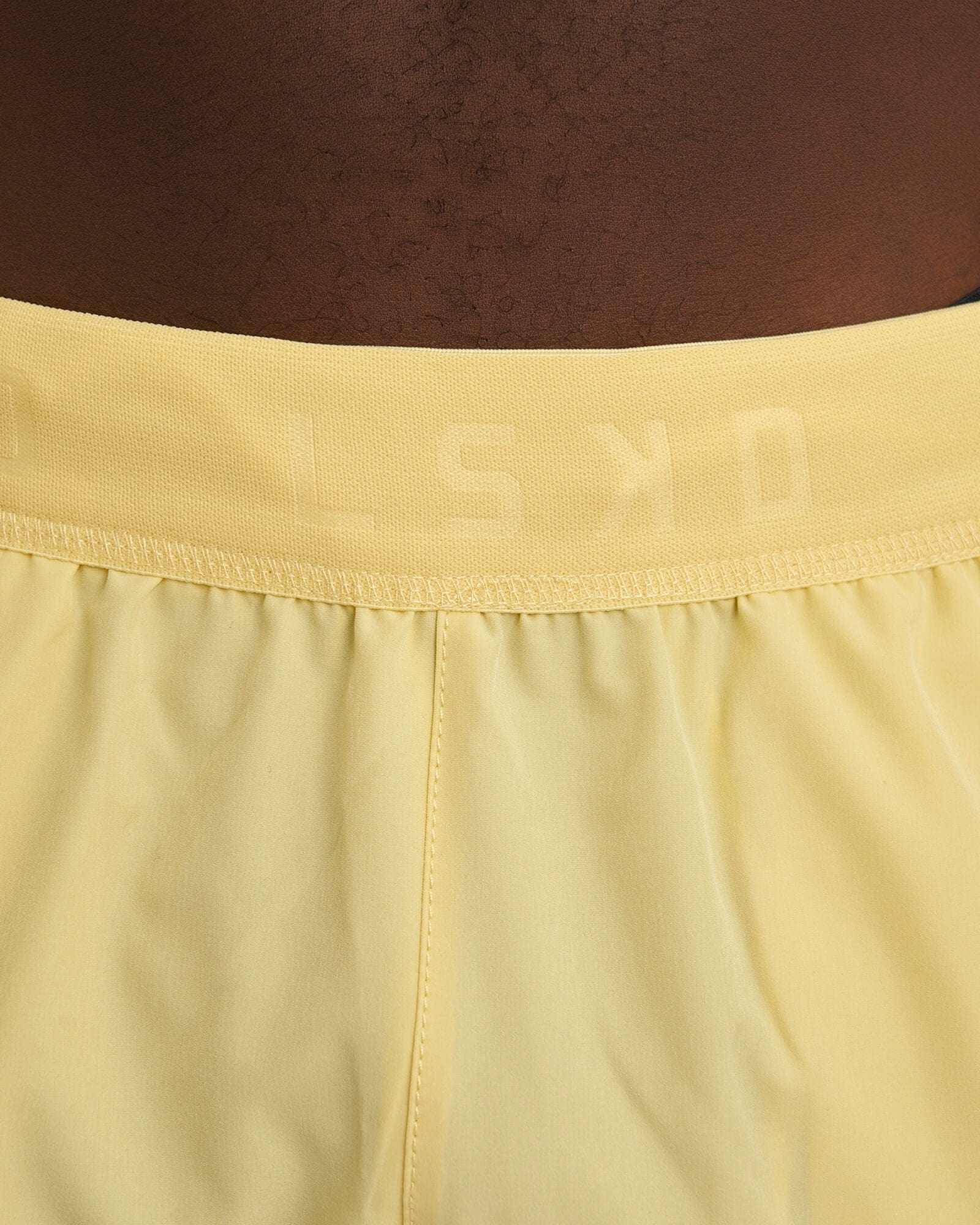 Model wearing Competition 8" Performance Short - Banana Smoothie