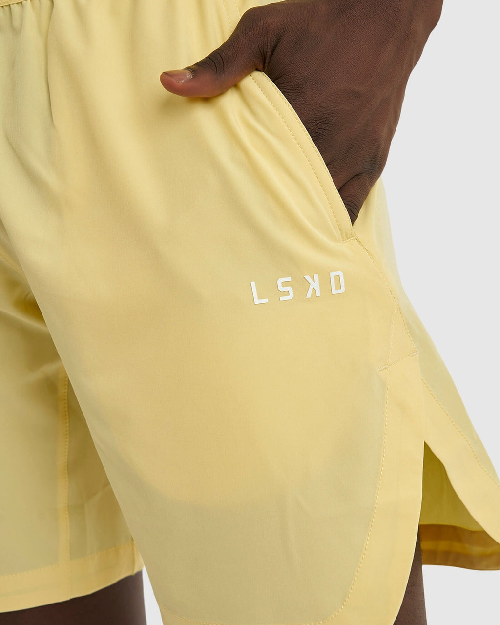 Model wearing Competition 8" Performance Short - Banana Smoothie