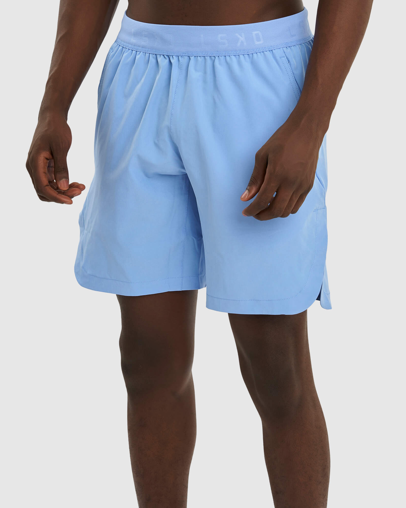 Model wearing Competition 8" Performance Short - Soft Blue