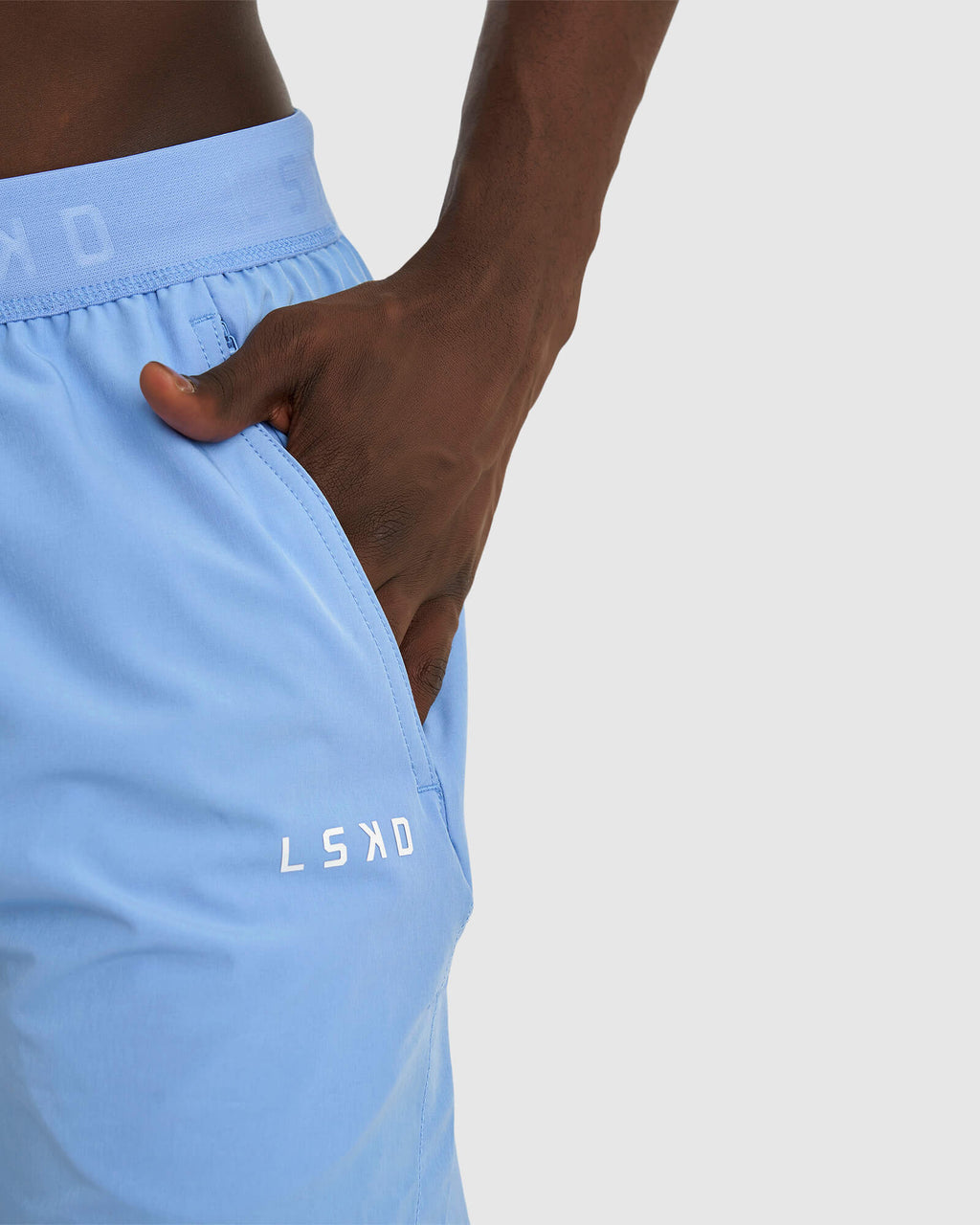 Model wearing Competition 8" Performance Short - Soft Blue