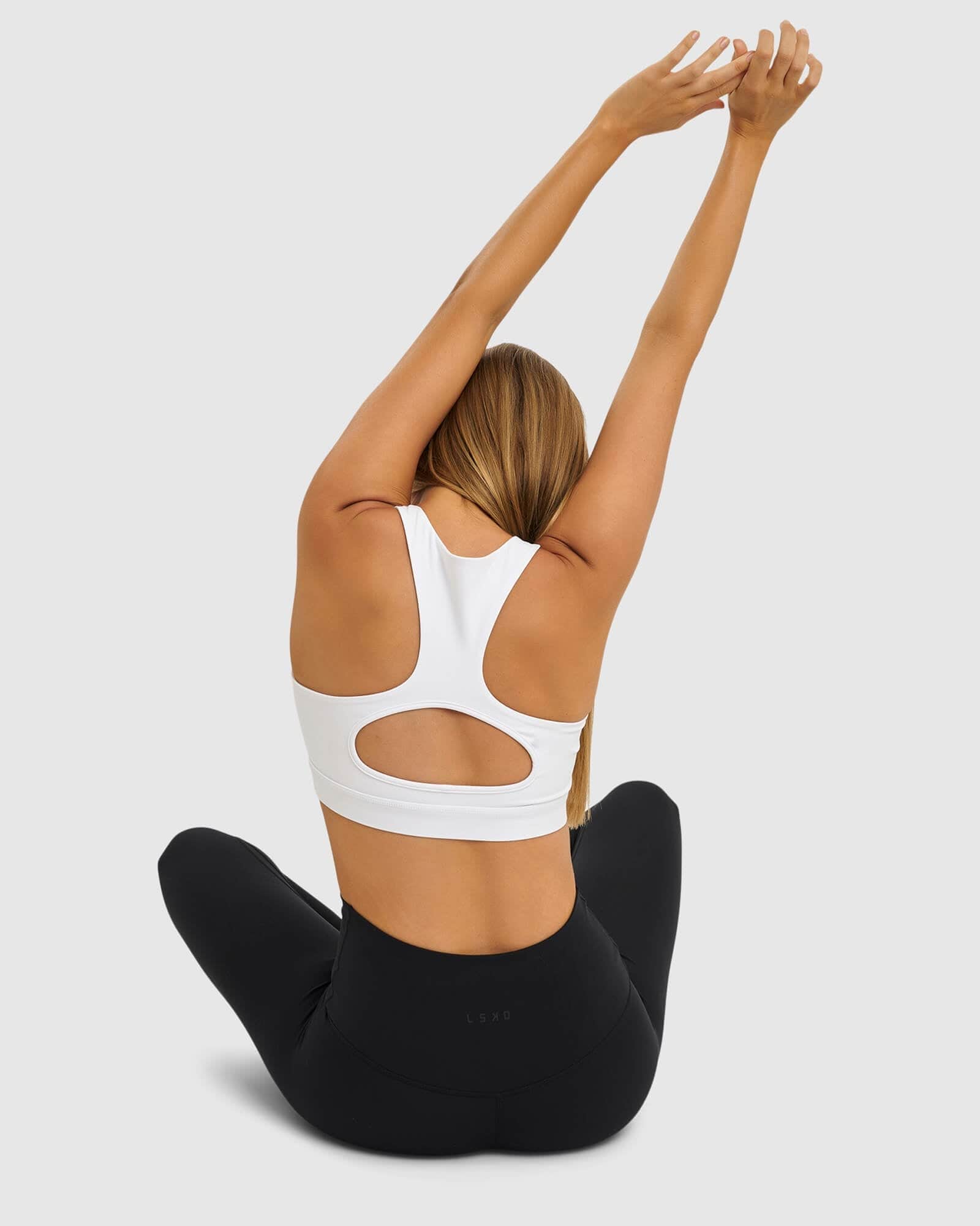 Model wearing Marker Sports Bra - White