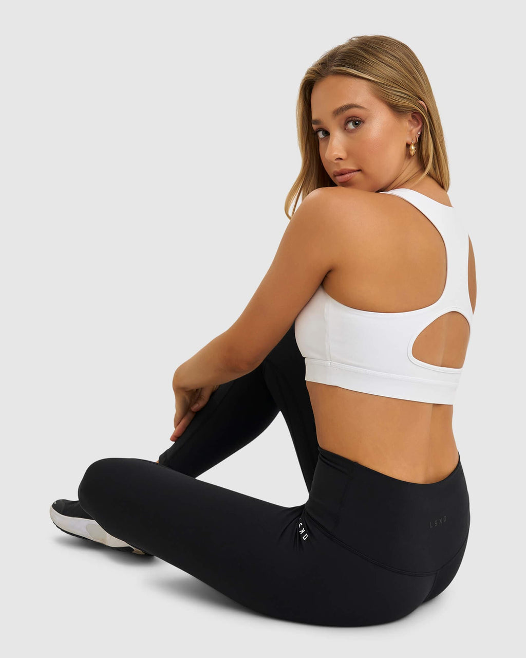 Model wearing Marker Sports Bra - White