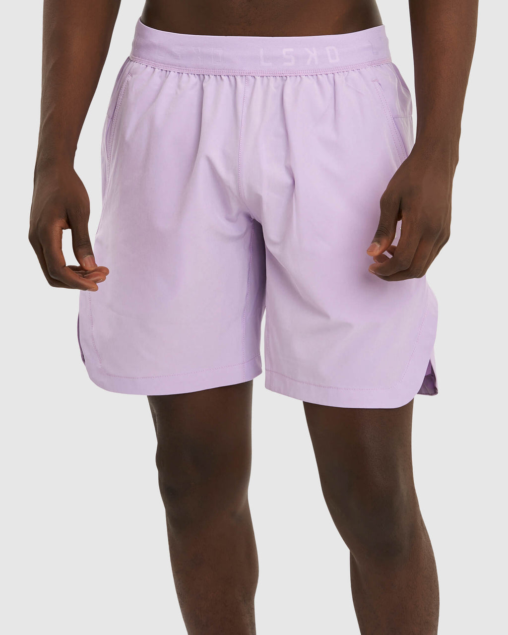 Model wearing Competition 8" Performance Short - Pastel Lilac