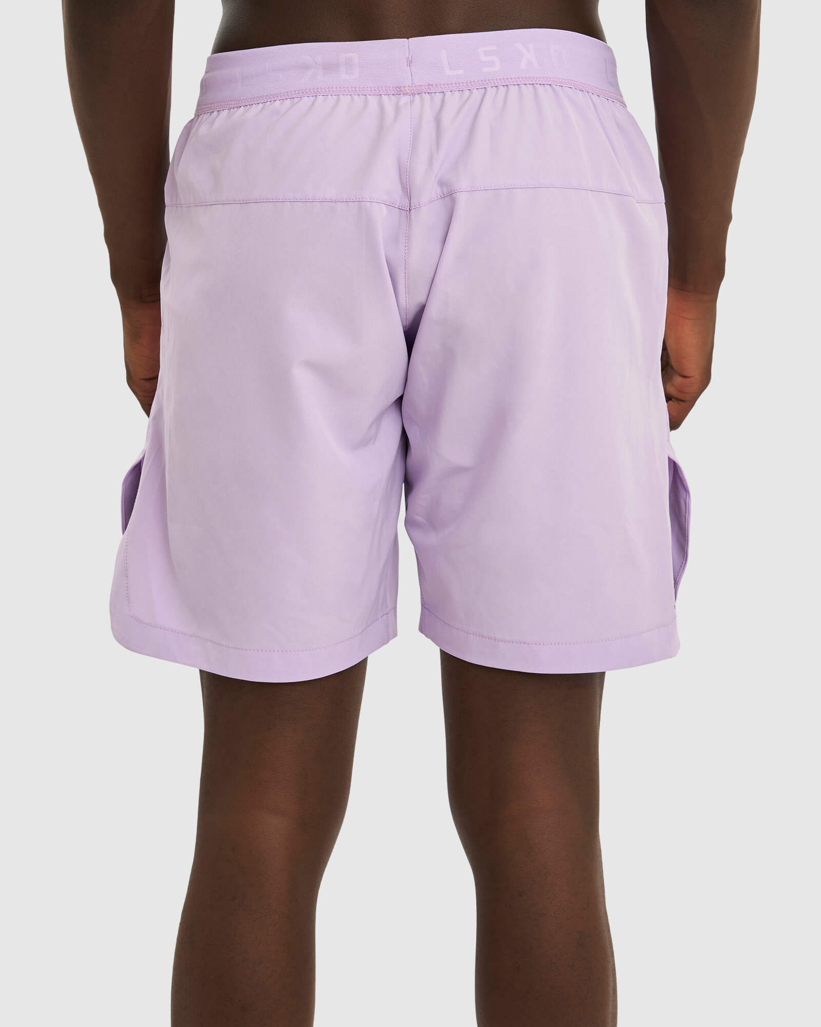 Model wearing Competition 8" Performance Short - Pastel Lilac