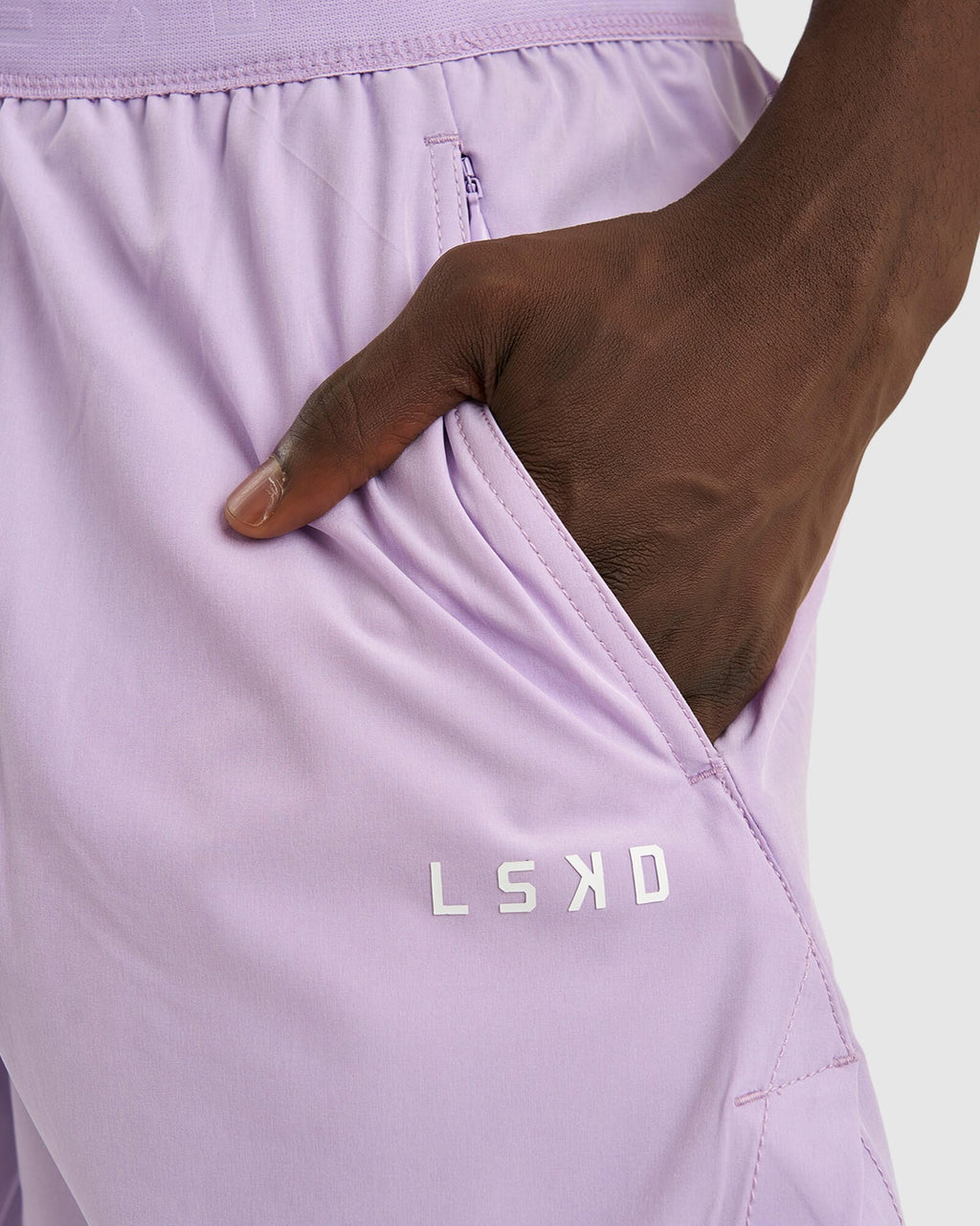 Model wearing Competition 8" Performance Short - Pastel Lilac