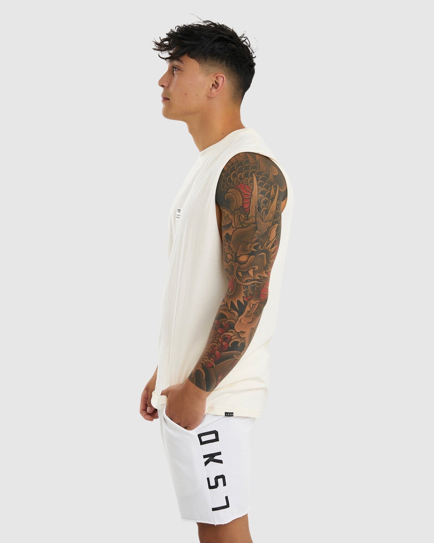 Model wearing Merch Tank Vintage Fit - Cream