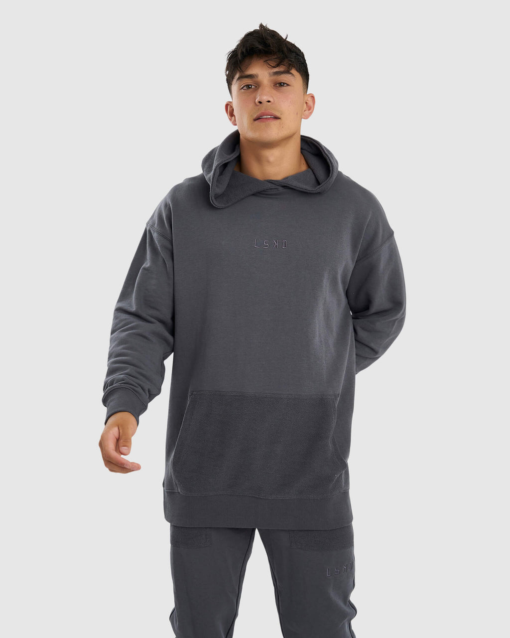 Model wearing Unisex Locker Room Hoodie Oversize - Iron