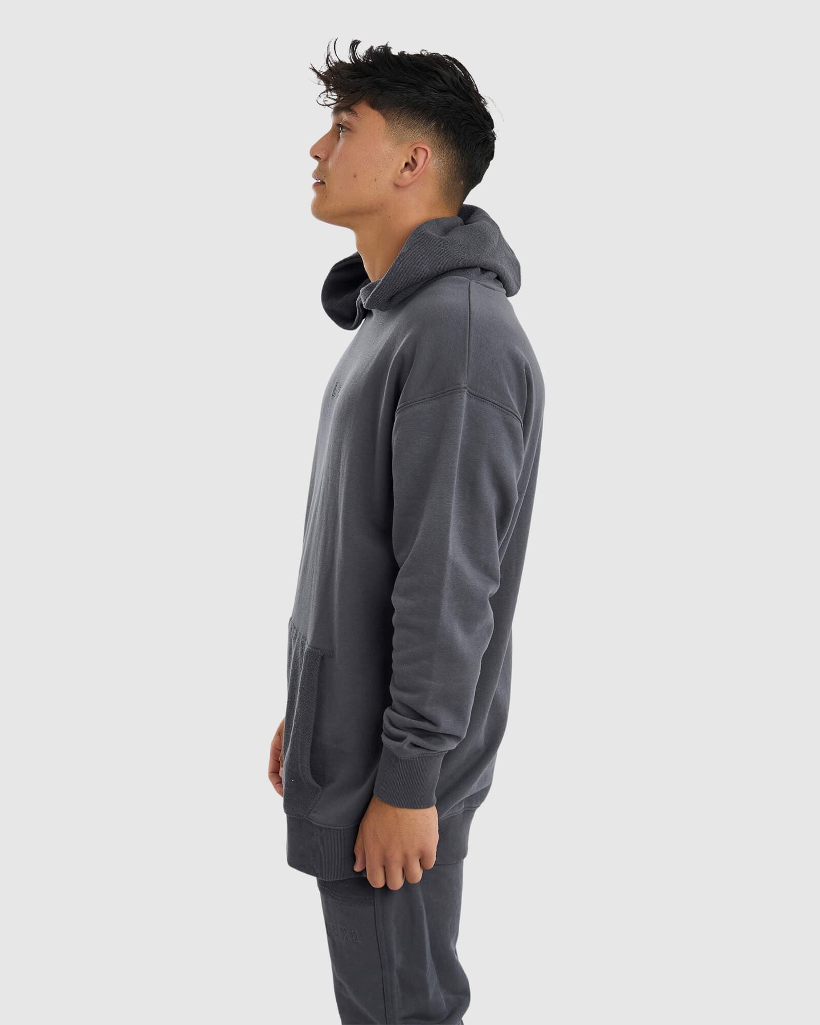 Model wearing Unisex Locker Room Hoodie Oversize - Iron