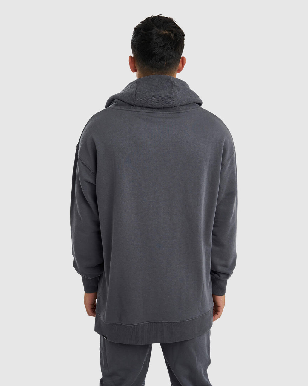 Model wearing Unisex Locker Room Hoodie Oversize - Iron