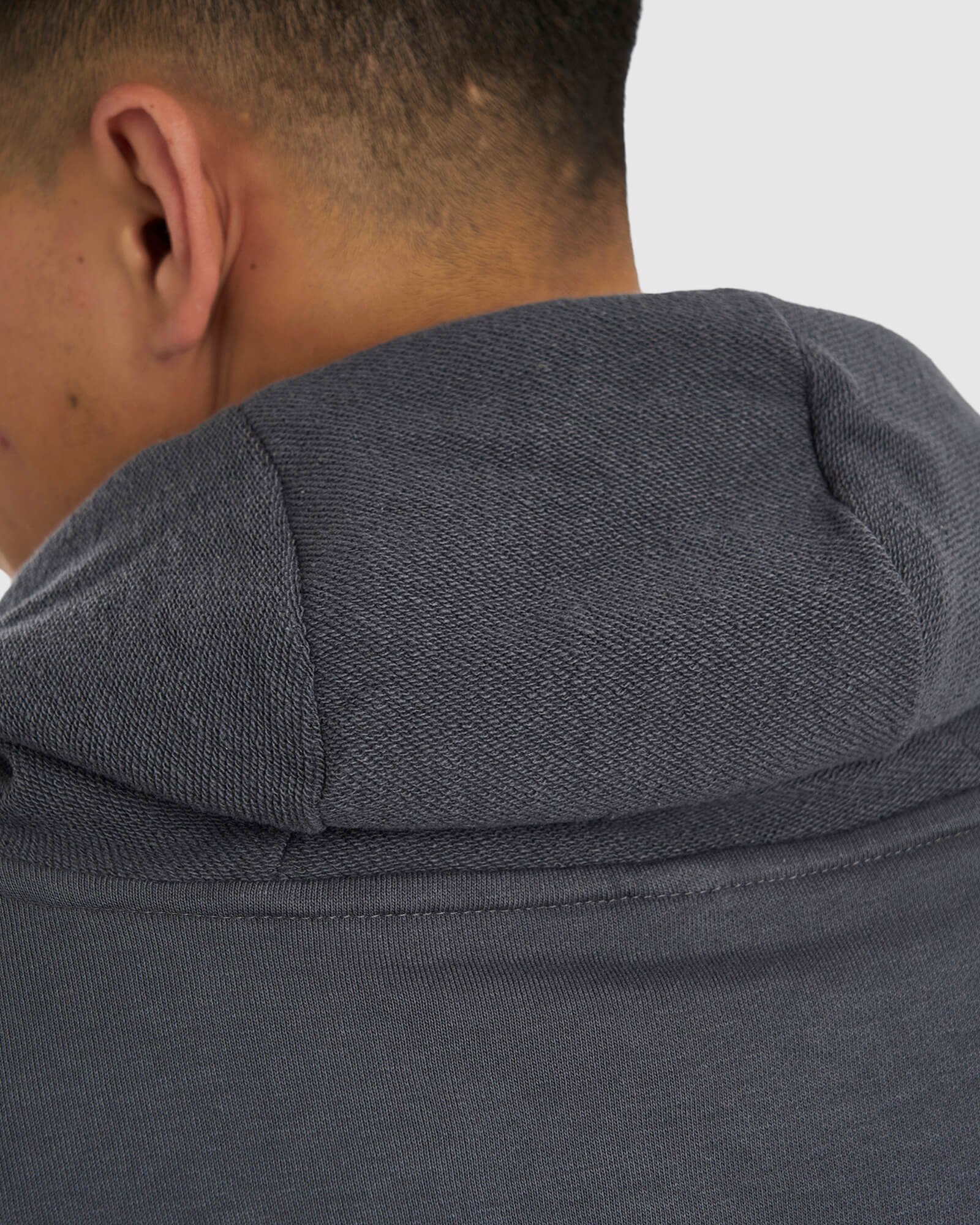 Model wearing Unisex Locker Room Hoodie Oversize - Iron