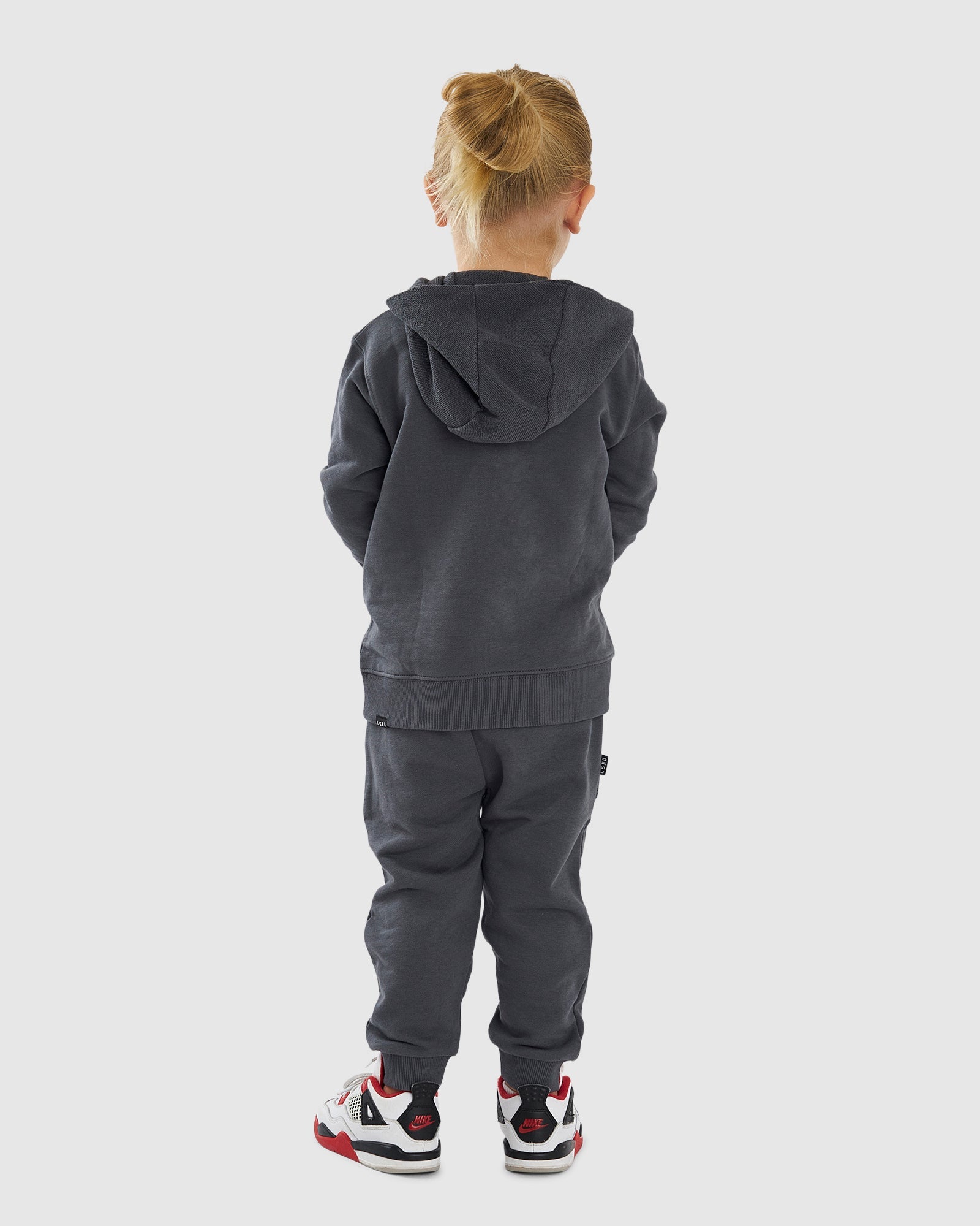 Model wearing Locker Room Track Pant (00-8) - Iron