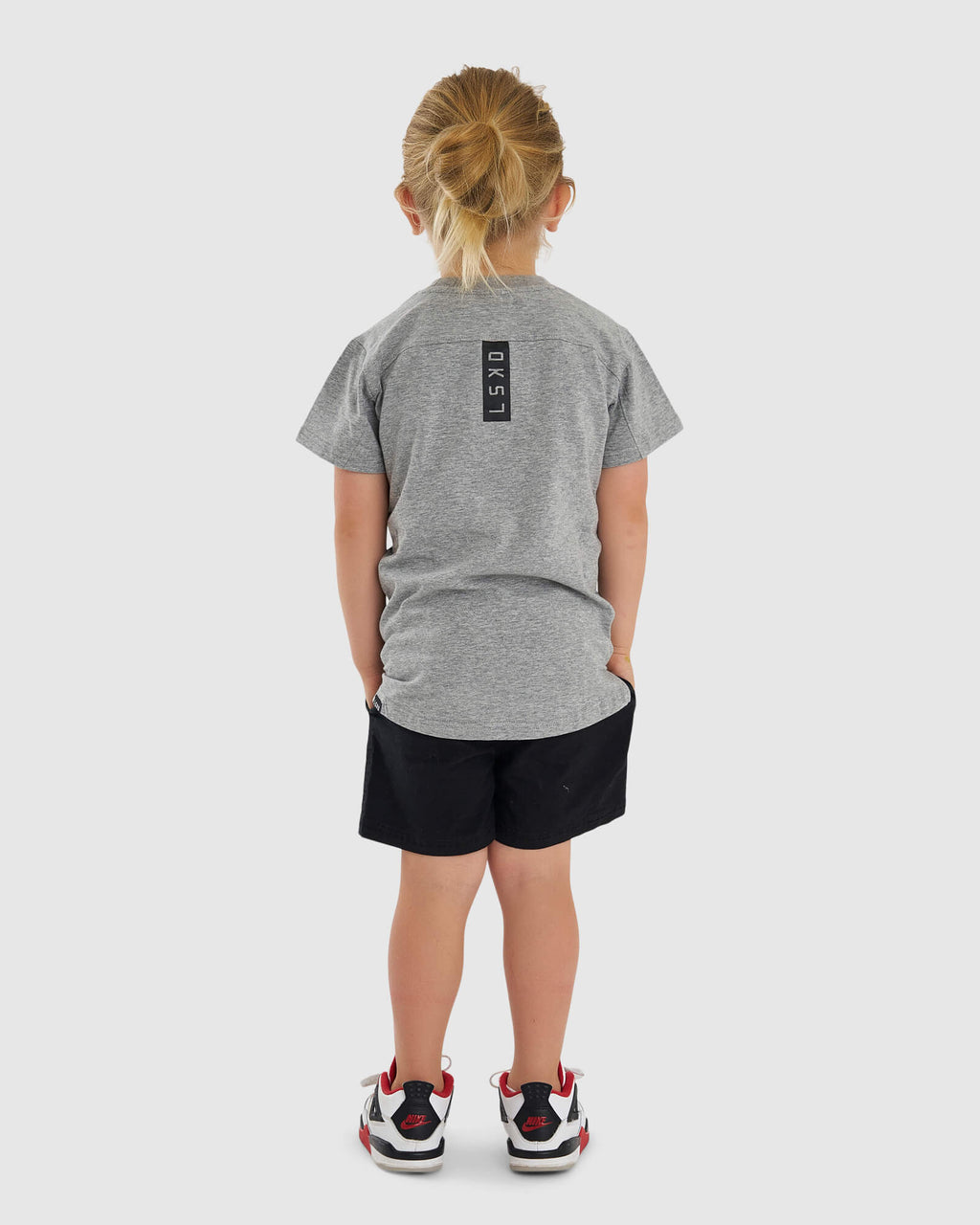 Model wearing Tab Tee (00-8) - Lt Grey Marl