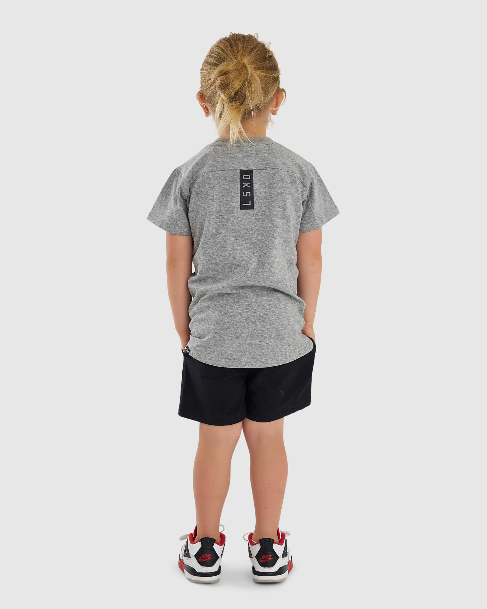 Model wearing Tab Tee (00-8) - Lt Grey Marl