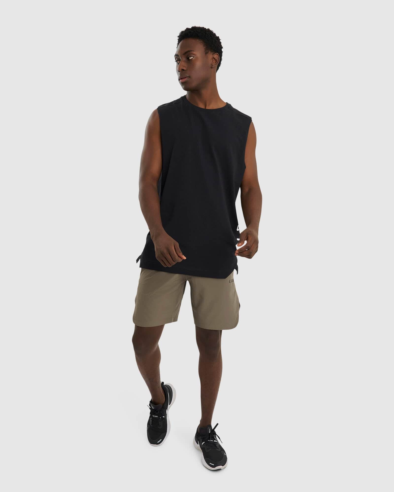 Model wearing Competition 8" Performance Short - Walnut Grey