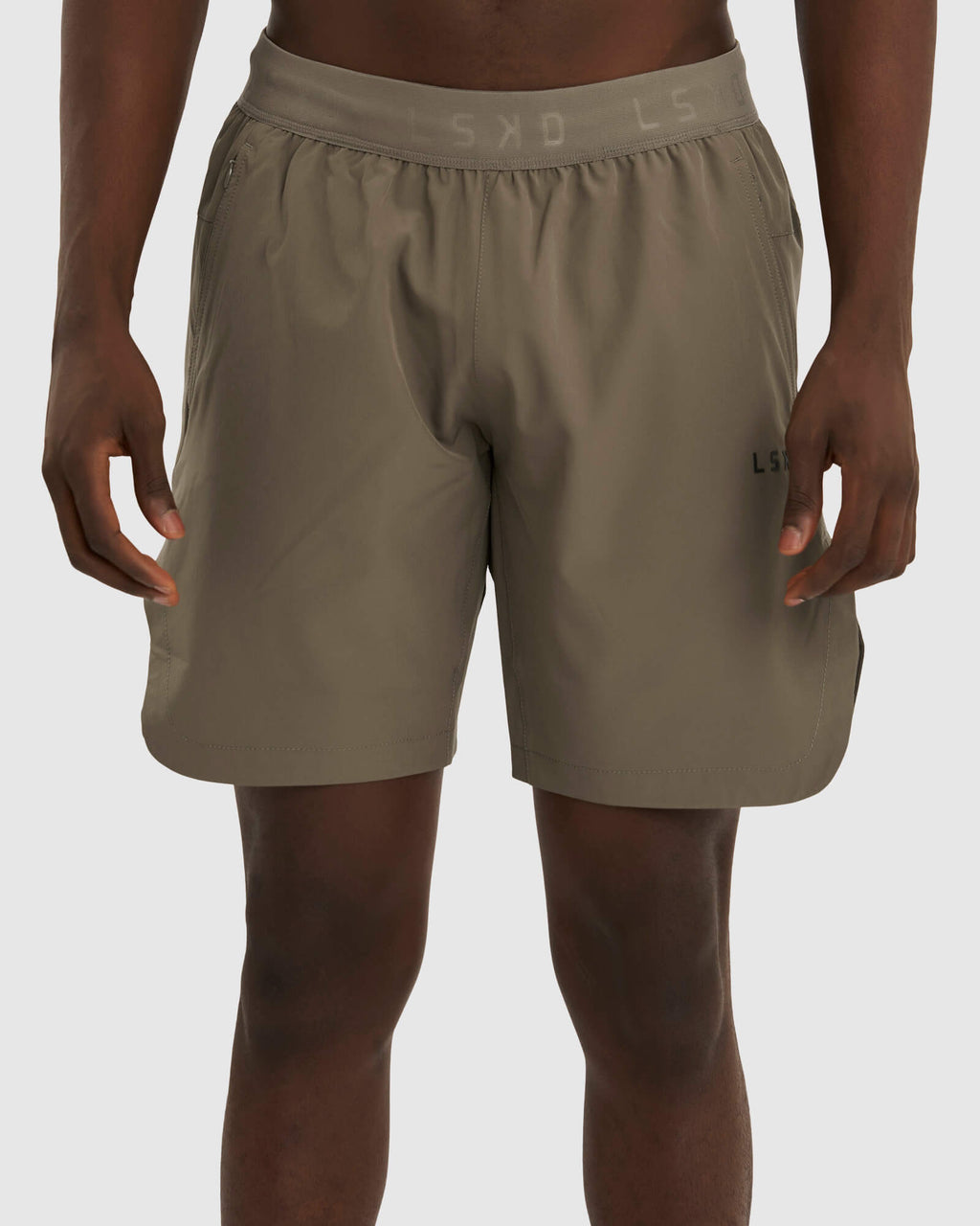 Model wearing Competition 8" Performance Short - Walnut Grey