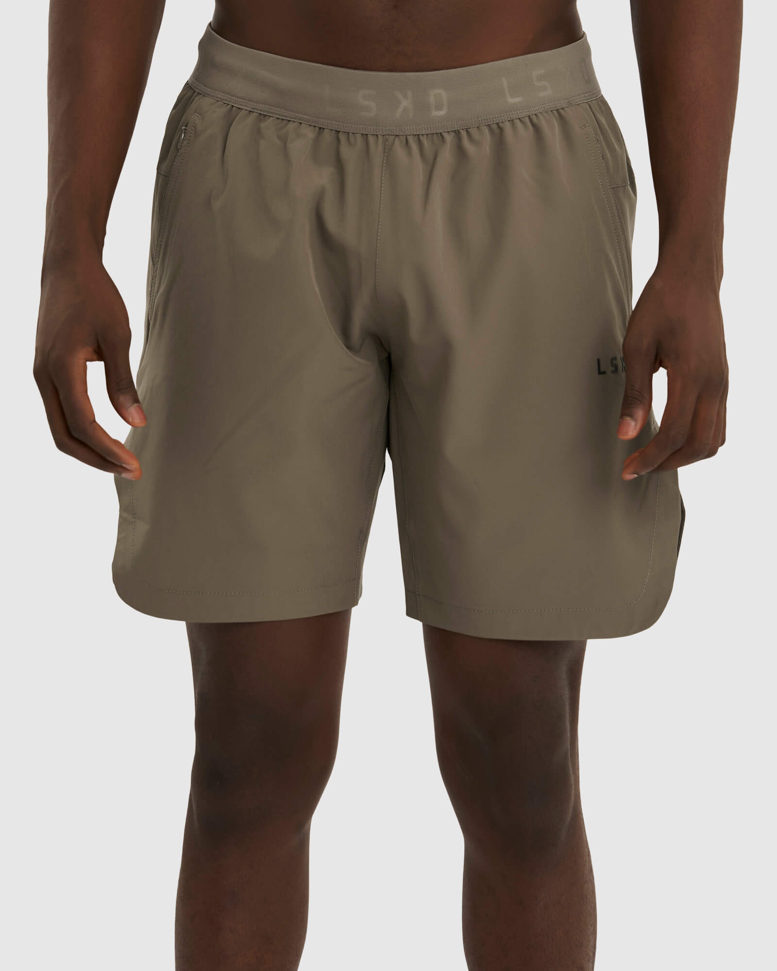 Model wearing Competition 8" Performance Short - Walnut Grey