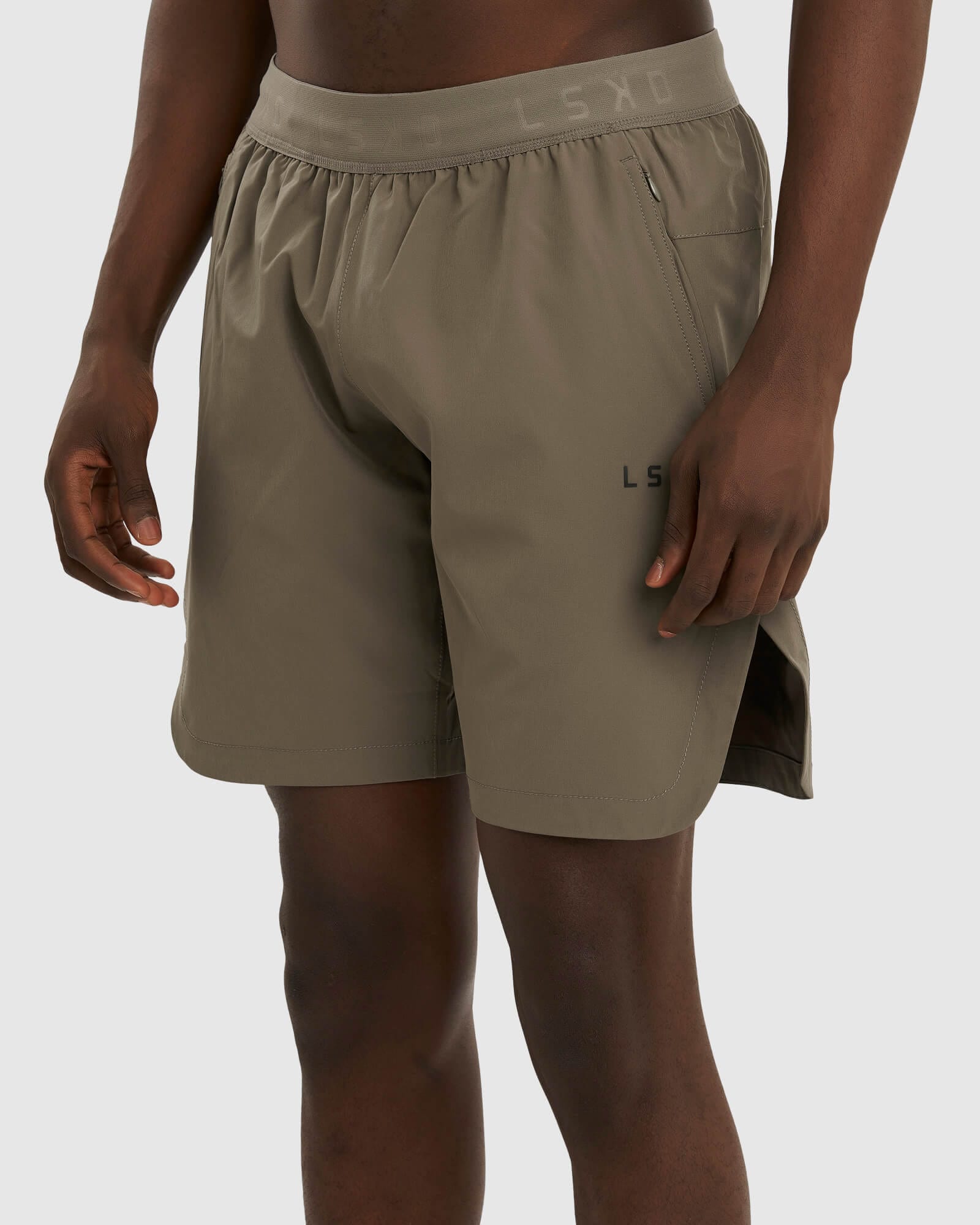 Model wearing Competition 8" Performance Short - Walnut Grey