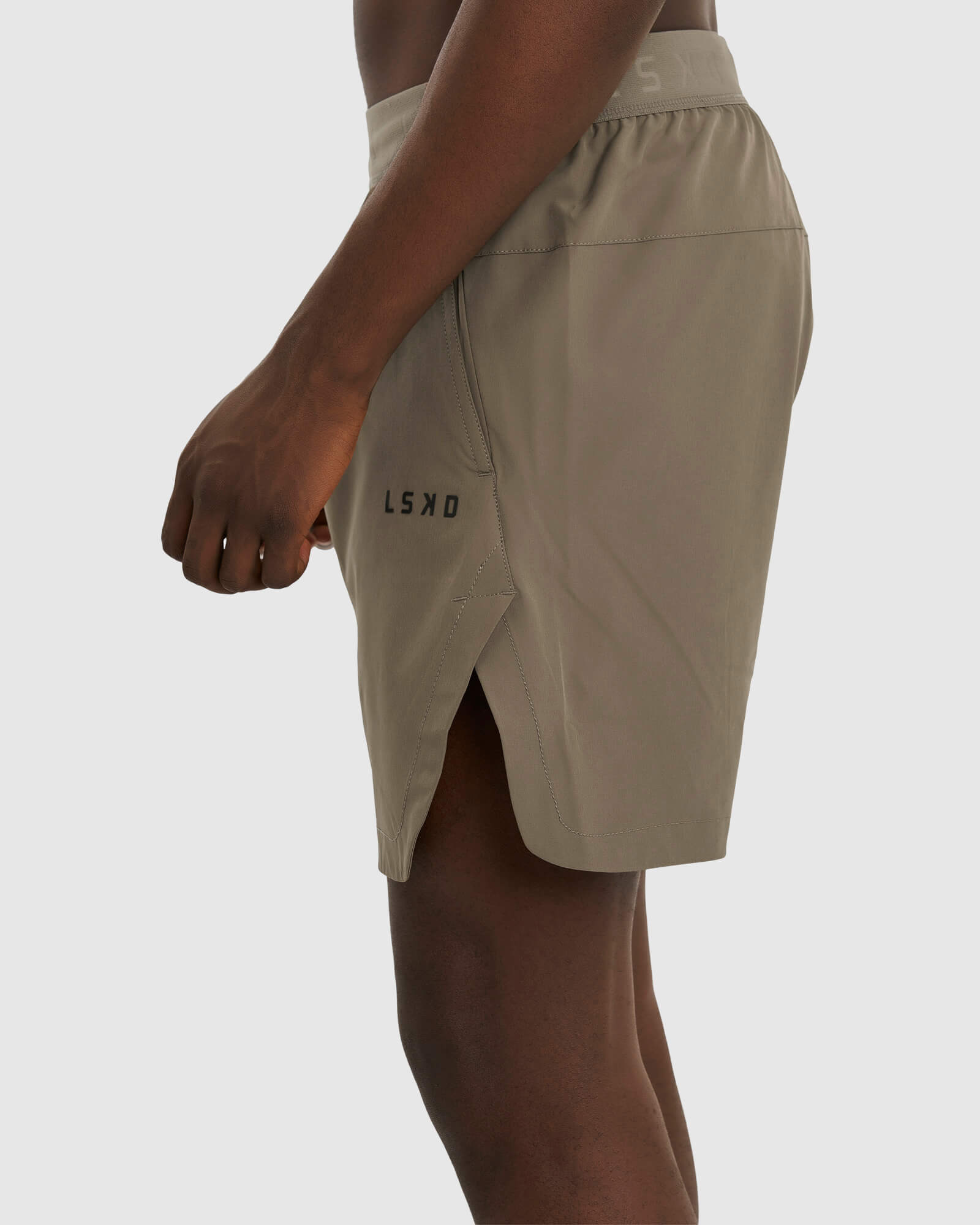 Model wearing Competition 8" Performance Short - Walnut Grey