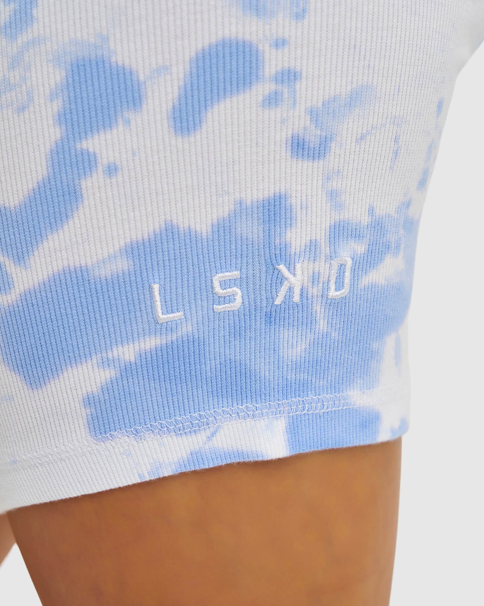 Model wearing Dymo Ribbed Bike Short - Soft Blue Tie Dye