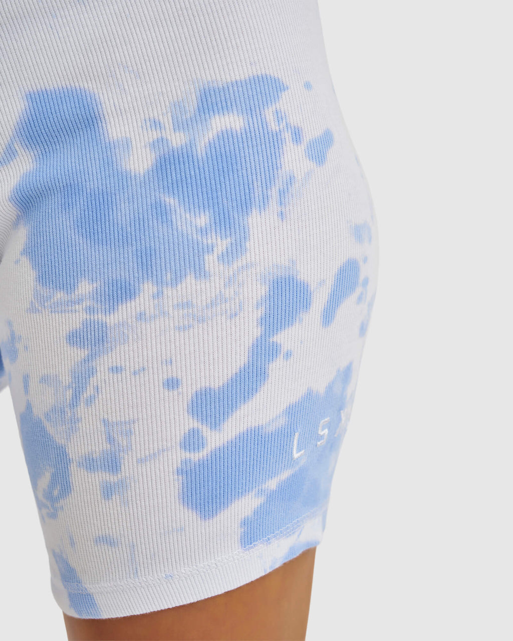 Model wearing Dymo Ribbed Bike Short - Soft Blue Tie Dye