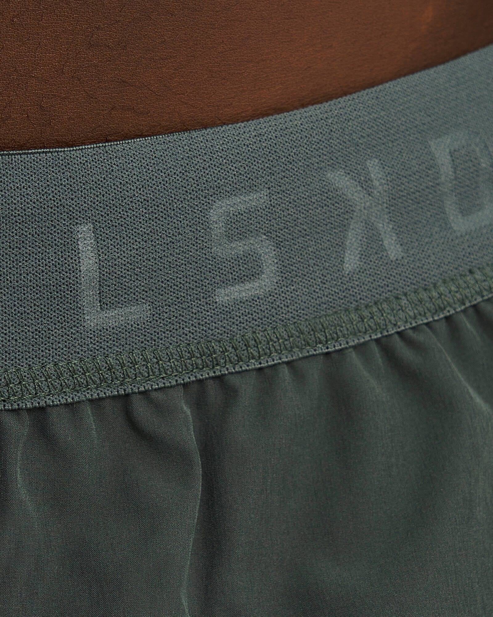 Model wearing Competition 8" Performance Short - Carbon Green