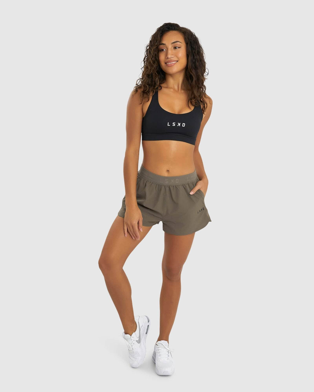 Model wearing Competition Performance Short - Walnut Grey
