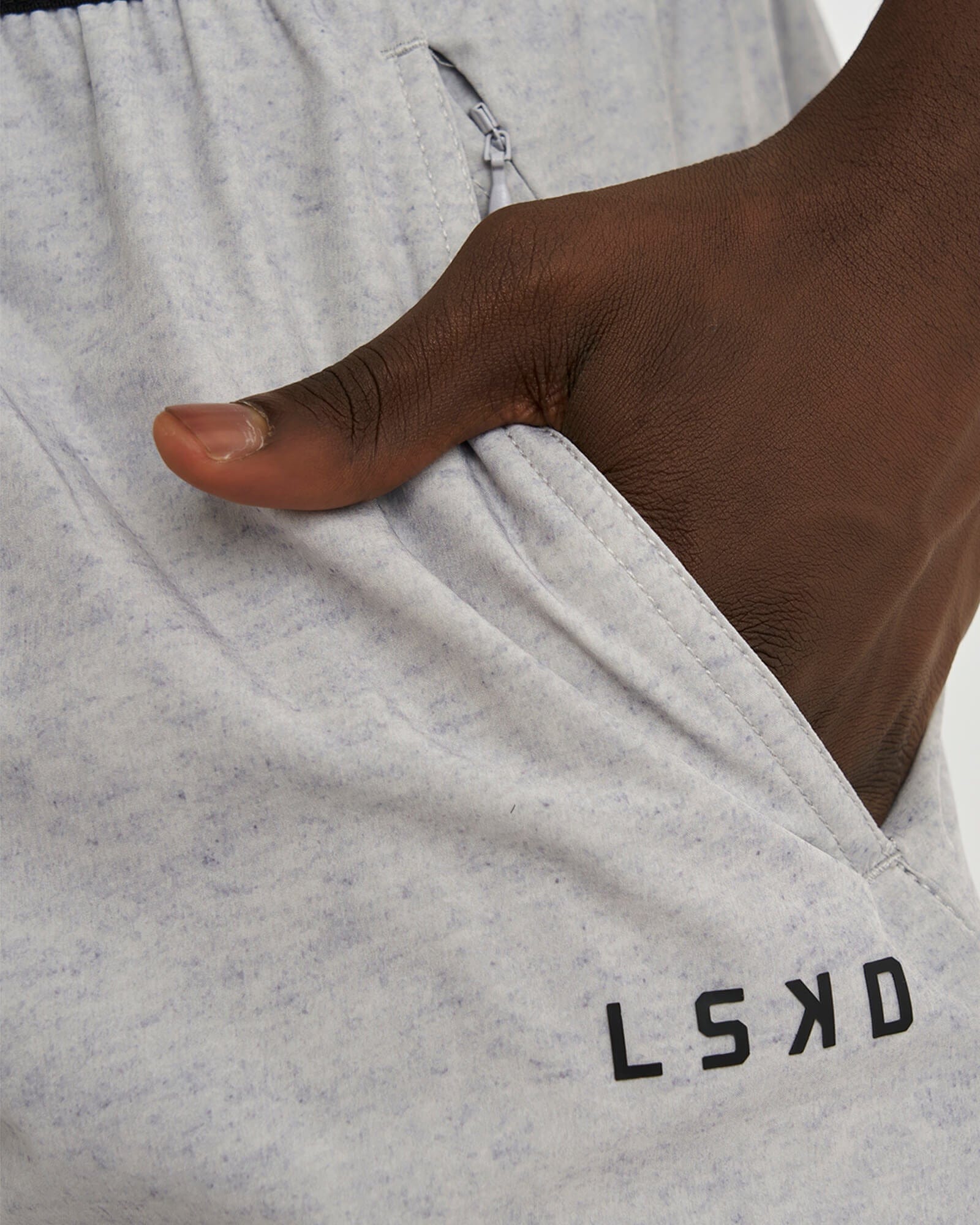 Model wearing Competition 8" Performance Short - Light Grey Marl