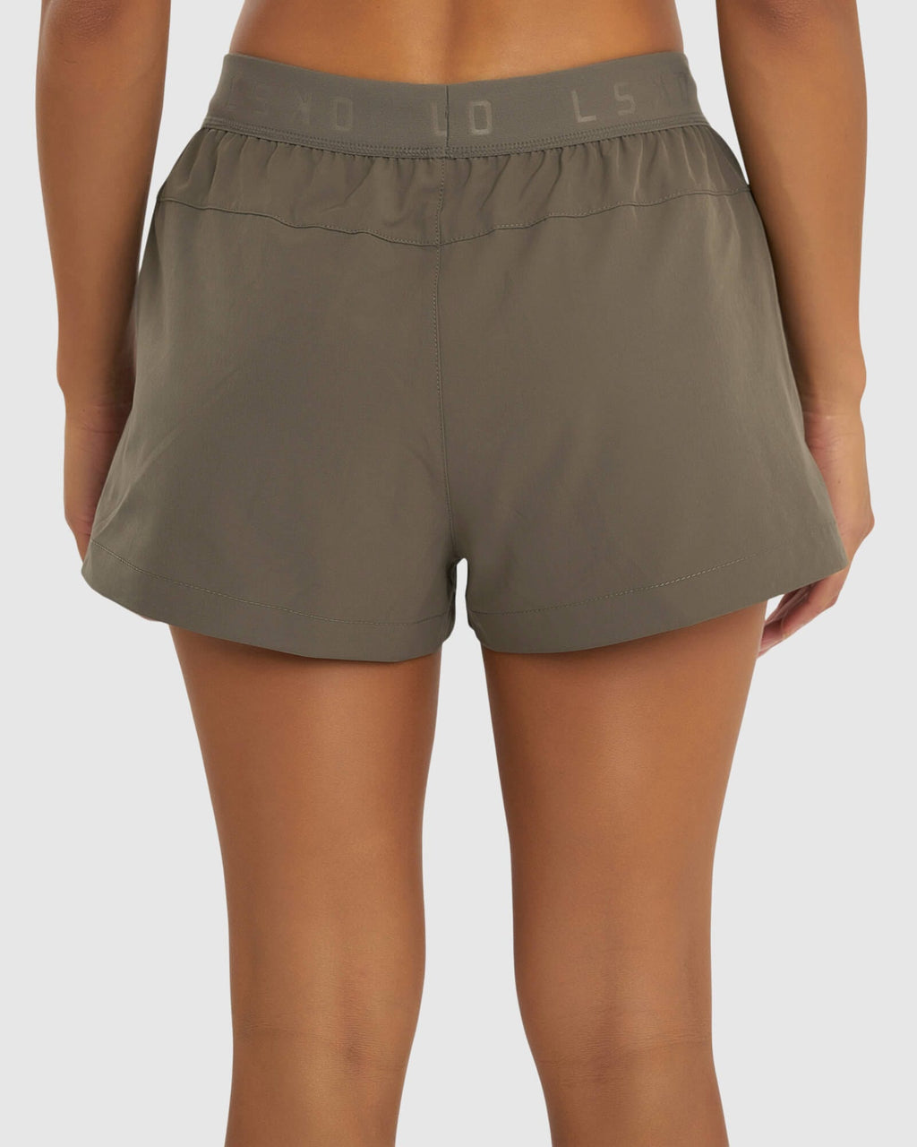 Model wearing Competition Performance Short - Walnut Grey
