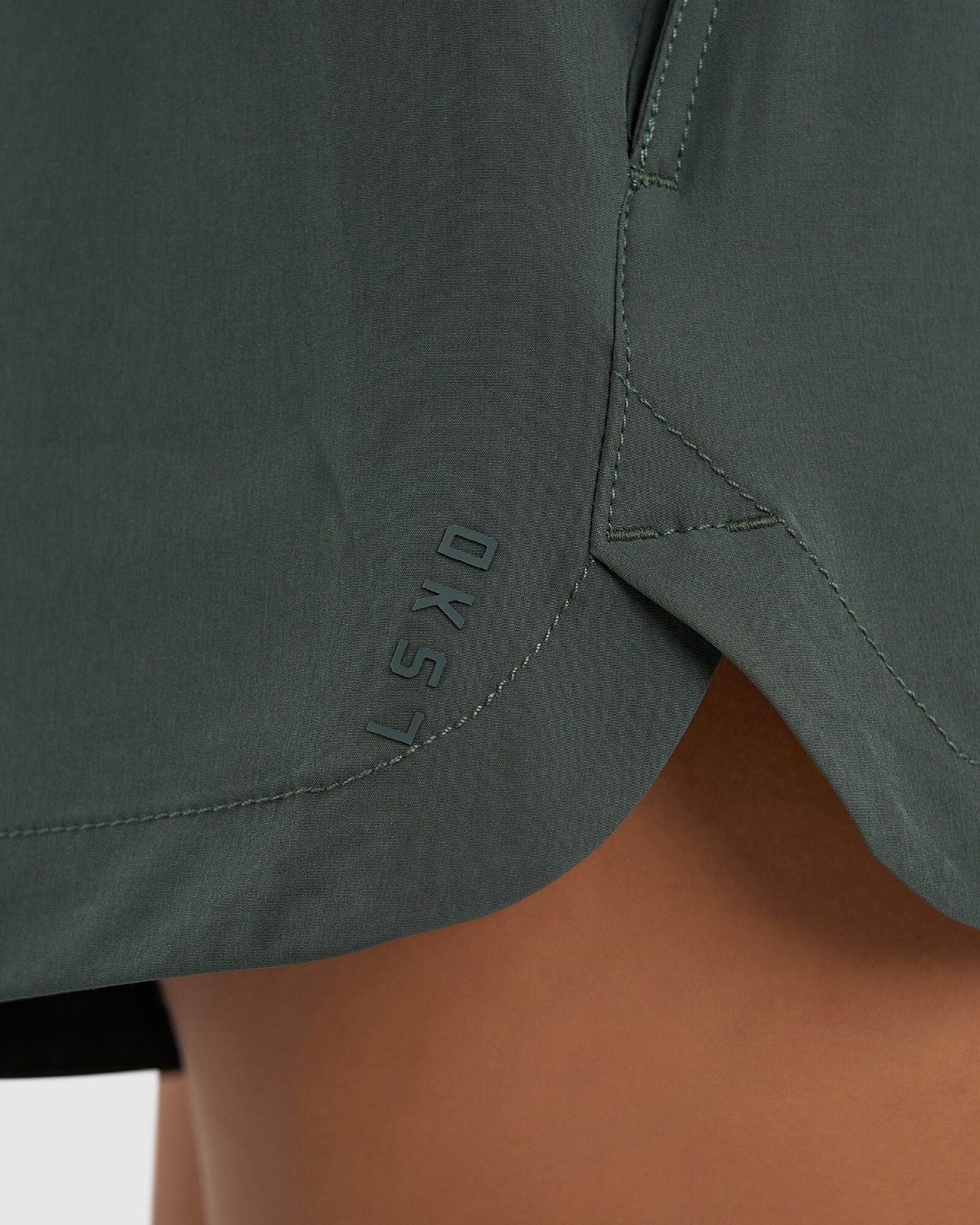 Model wearing Competition Performance Short - Carbon Green