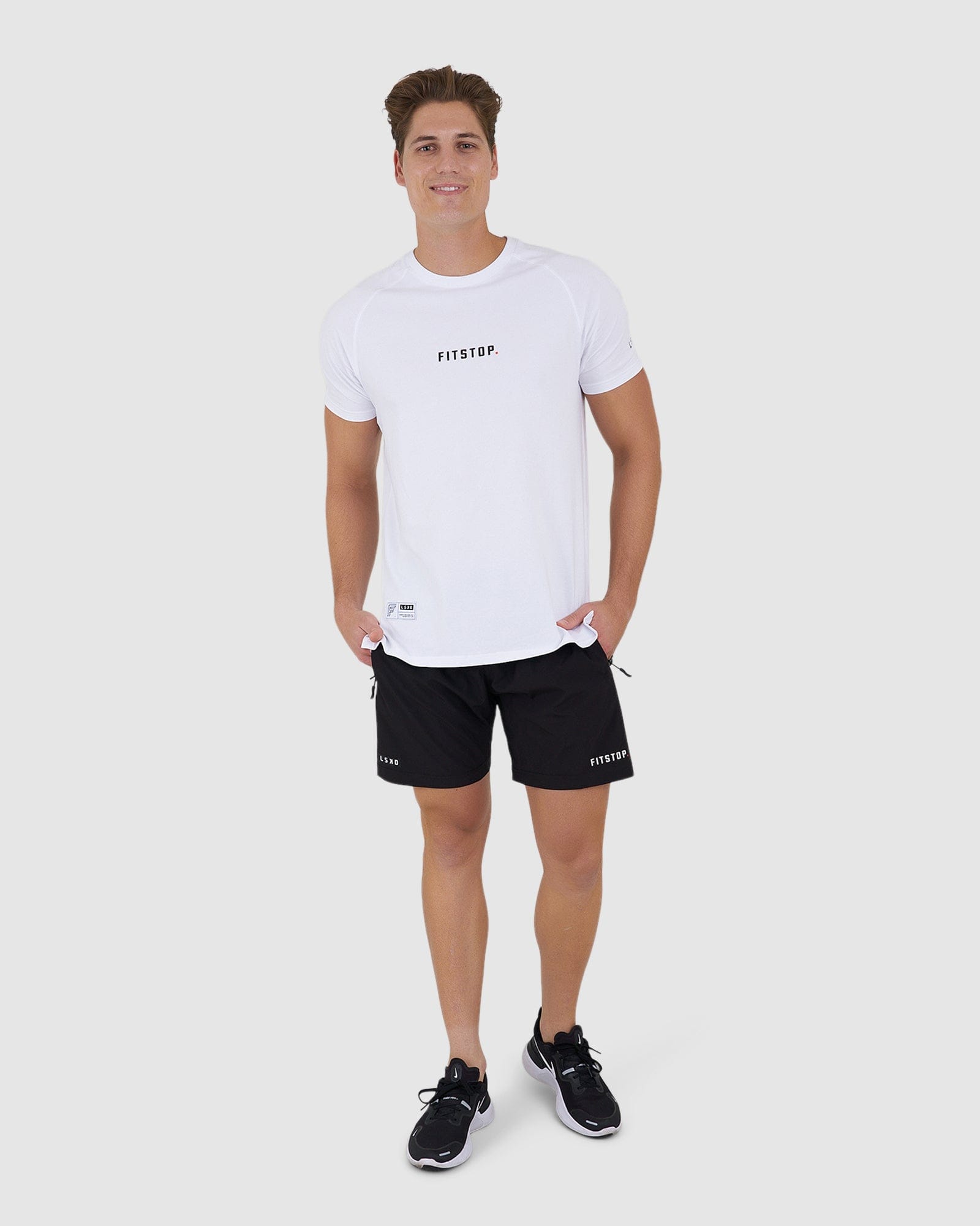 Model wearing Fitstop Optimal Tee - White