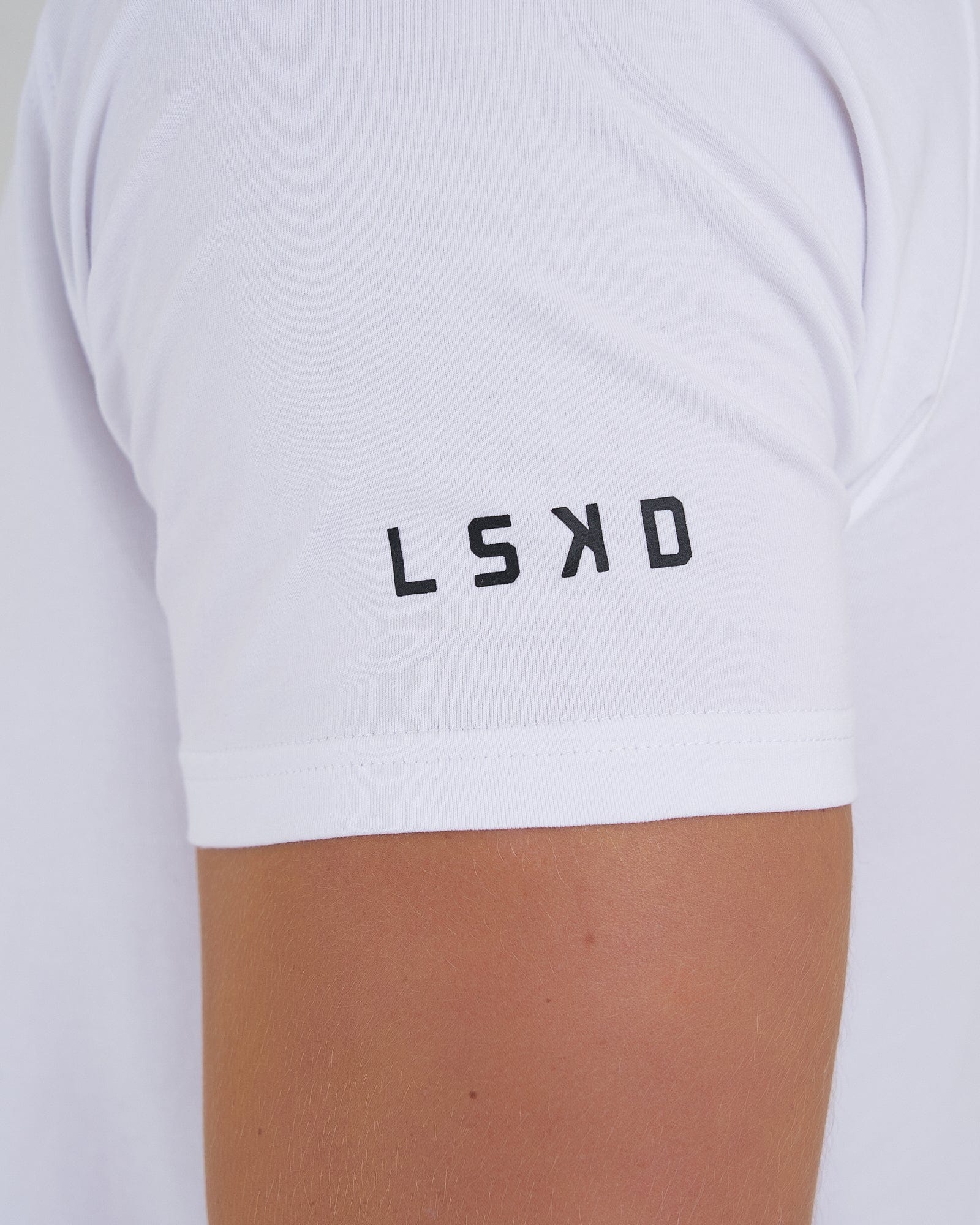 Model wearing Fitstop Optimal Tee - White