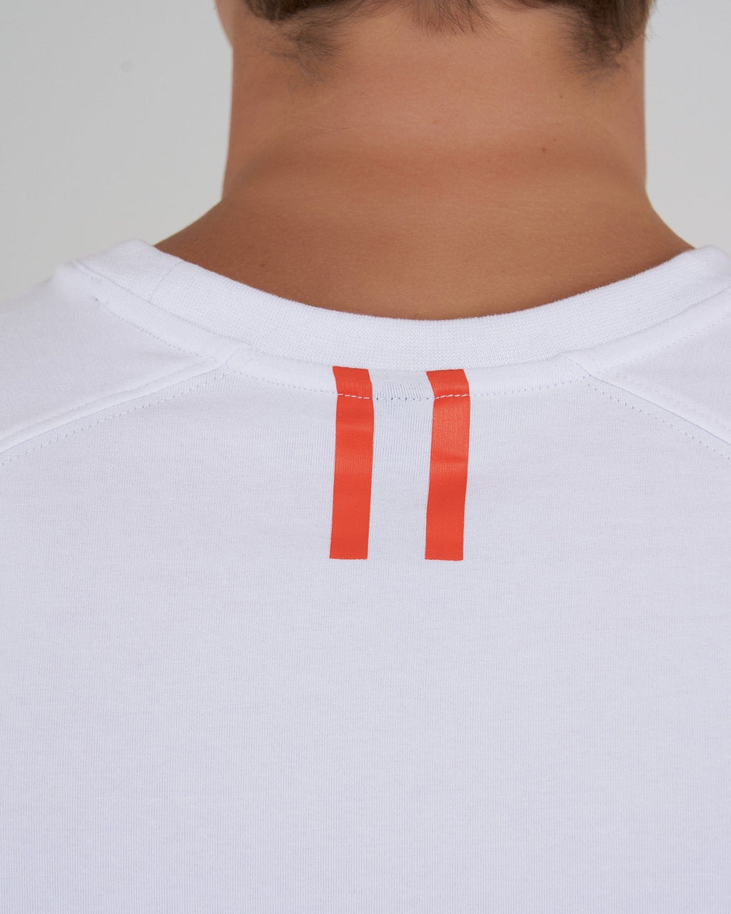 Model wearing Fitstop Optimal Tee - White