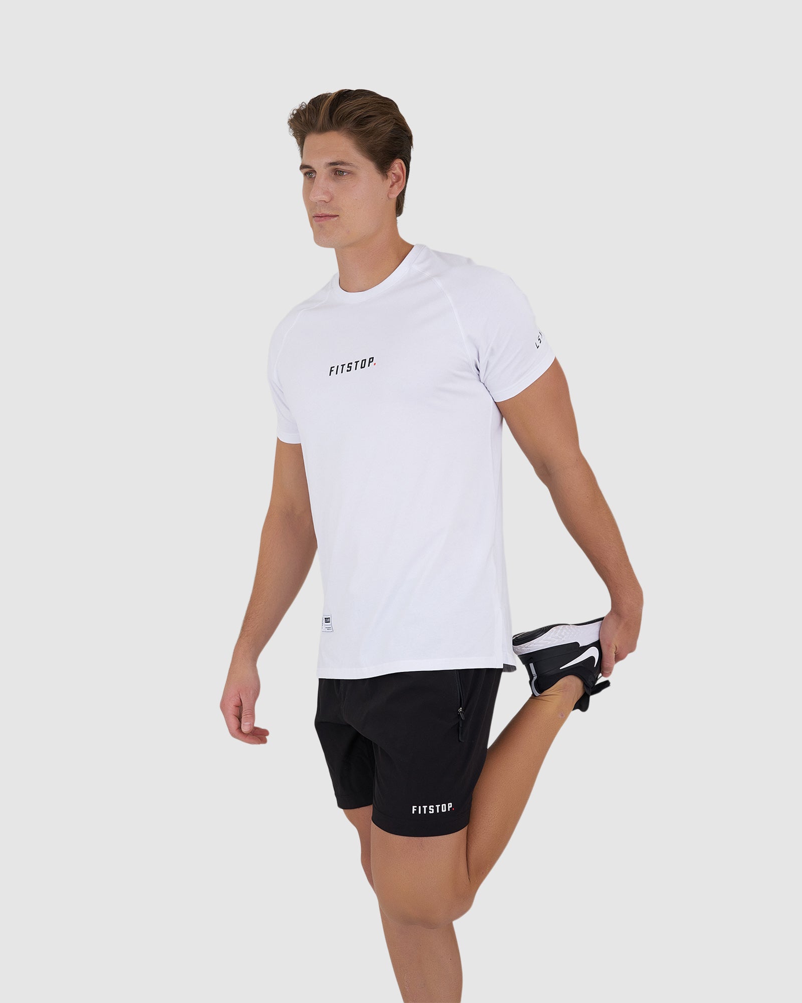Model wearing Fitstop Optimal Tee - White