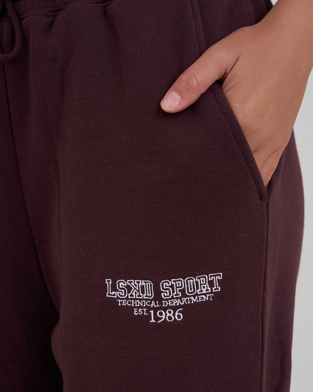 Model wearing Ivy Track Pant - Fudge