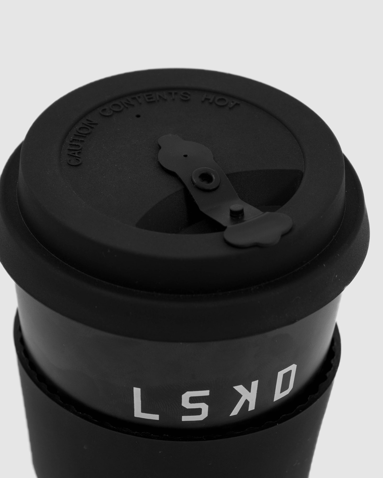 Model wearing Hot Shot Reusable Coffee Cup - Black