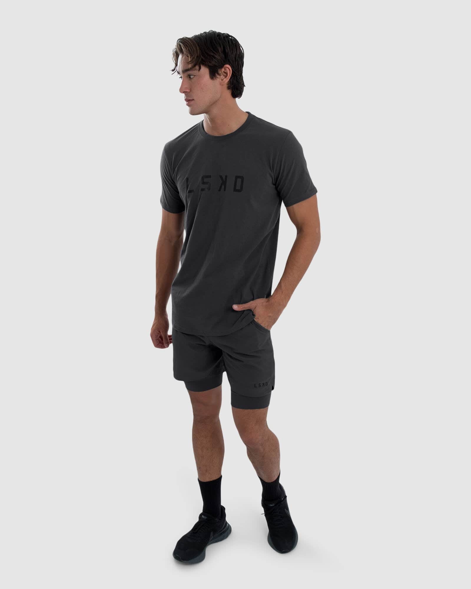Model wearing Power 7" Performance Liner Short - Asphalt