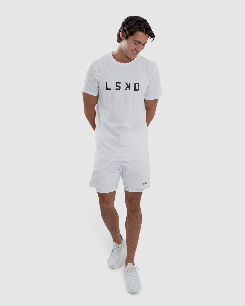 Model wearing Power 7" Performance Liner Short - White