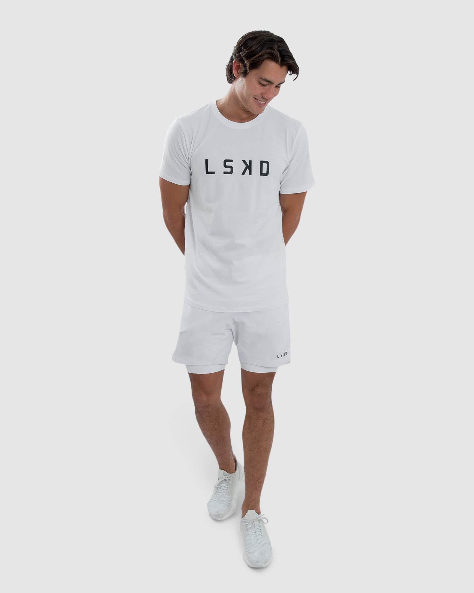 Model wearing Power 7" Performance Liner Short - White