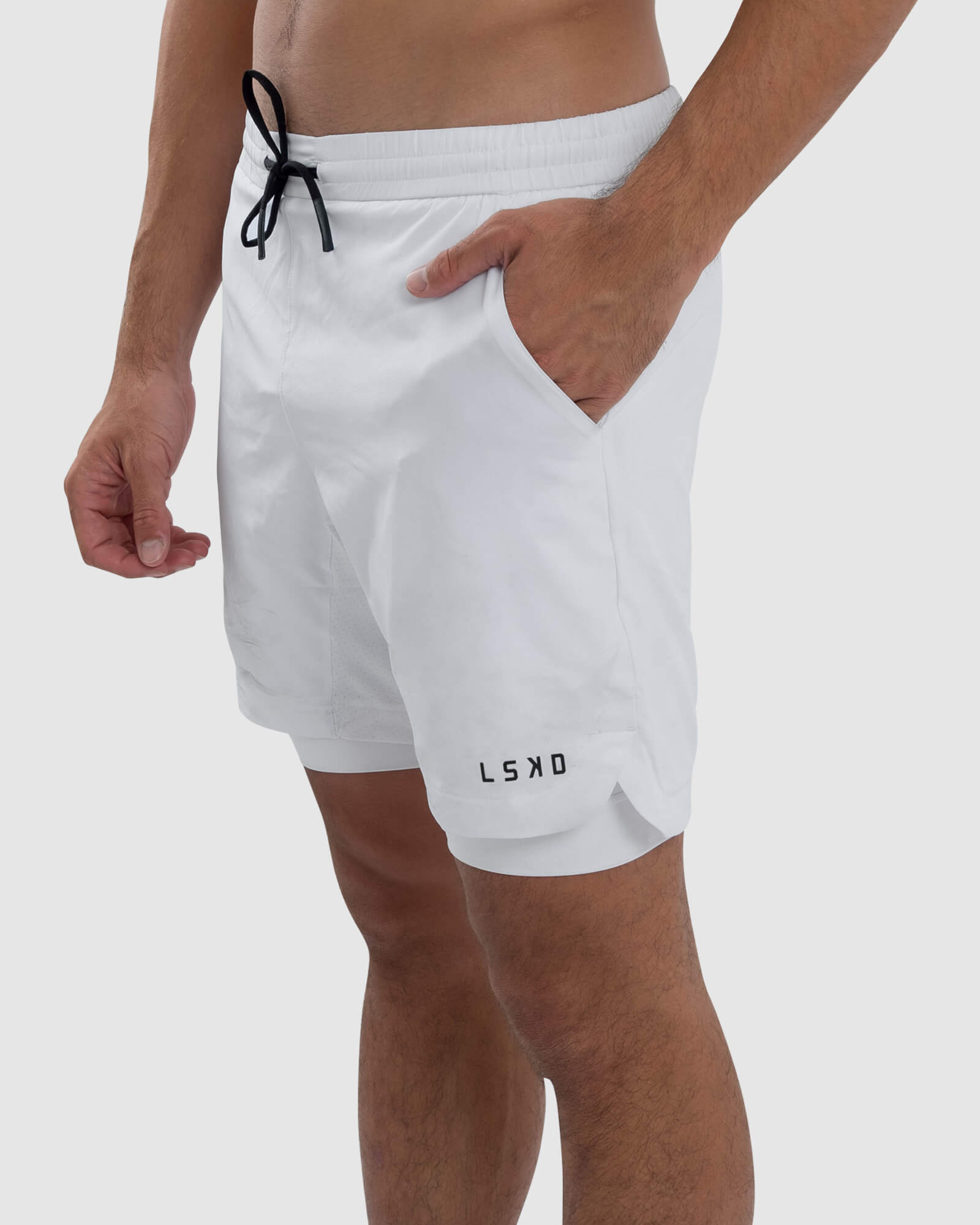 Model wearing Power 7" Performance Liner Short - White
