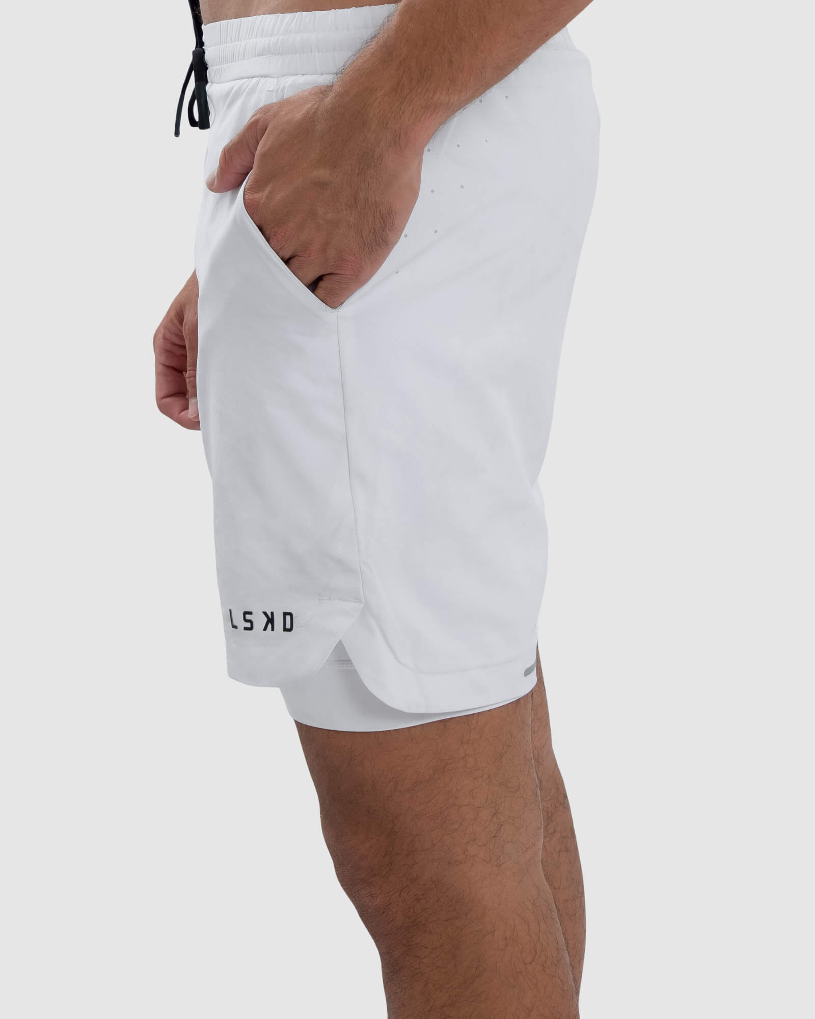 Model wearing Power 7" Performance Liner Short - White