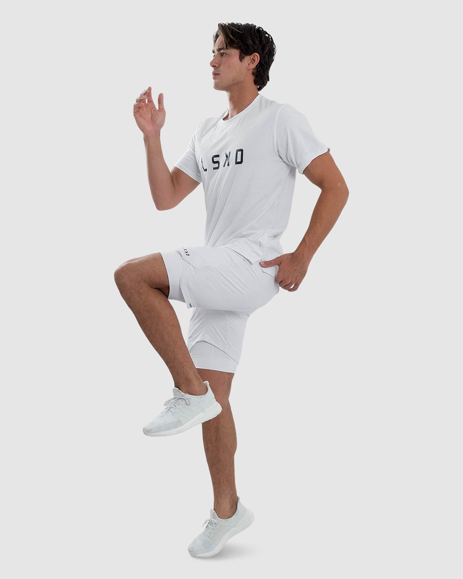 Model wearing Power 7" Performance Liner Short - White