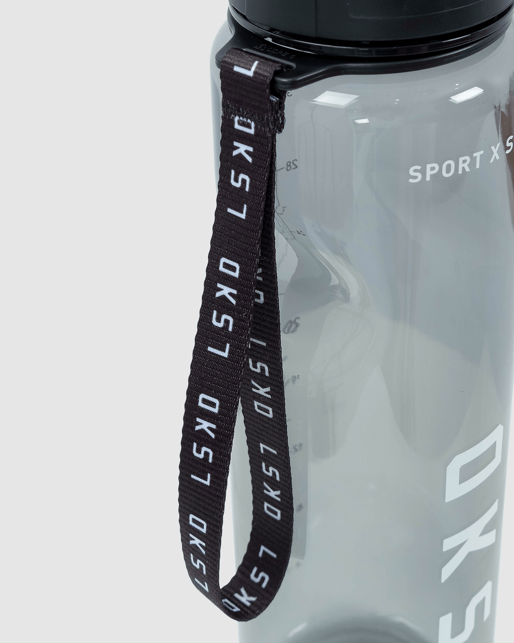 Model wearing Rep 1L Plastic Bottle - Black