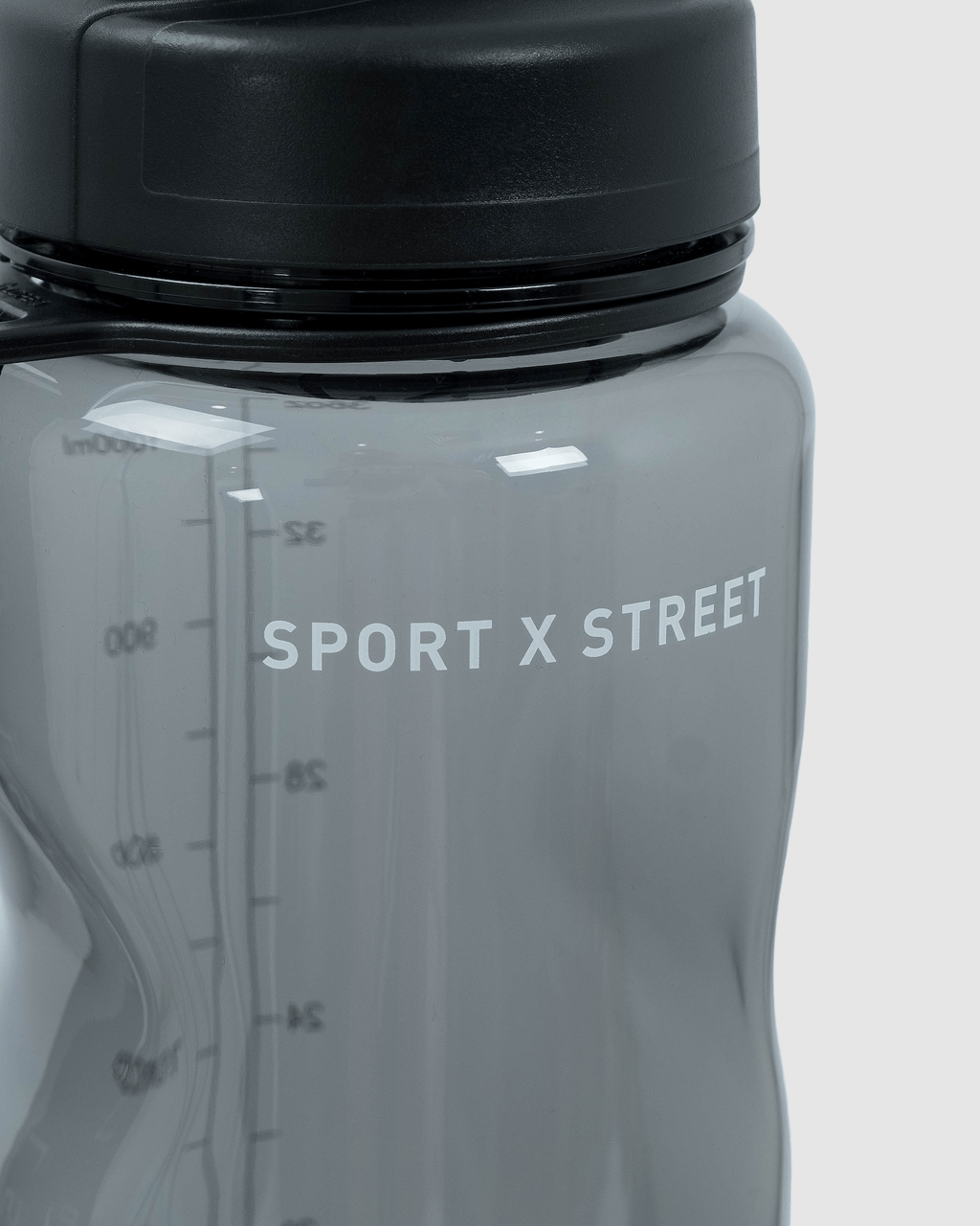 Model wearing Rep 1L Plastic Bottle - Black