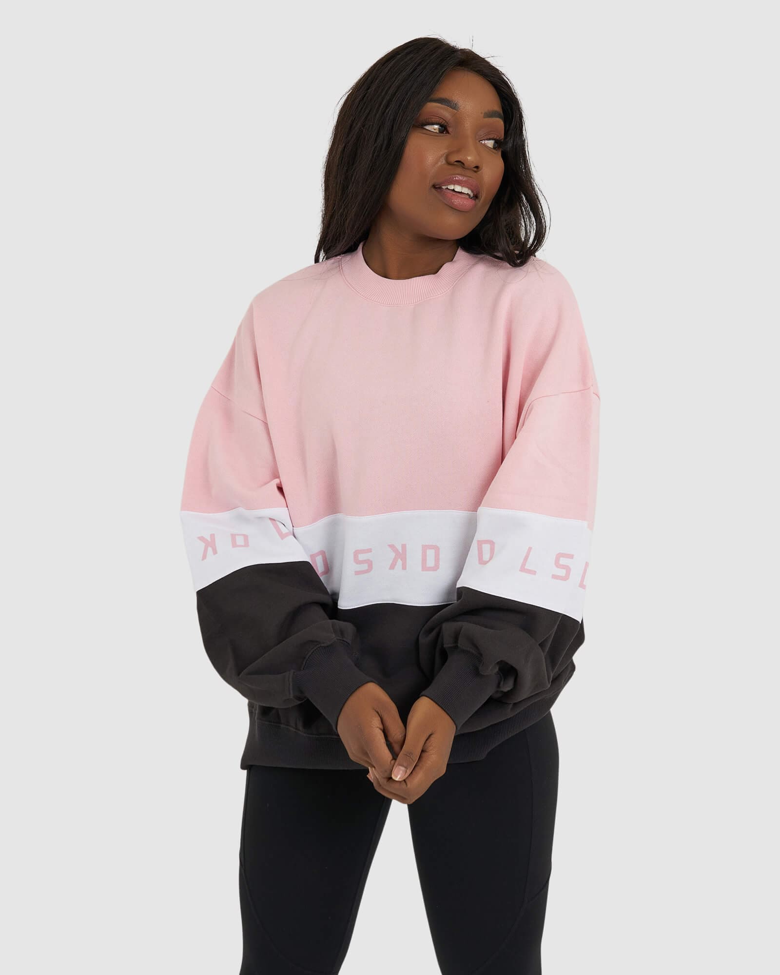 Model wearing Disc Sweater Oversize - Petal Pink