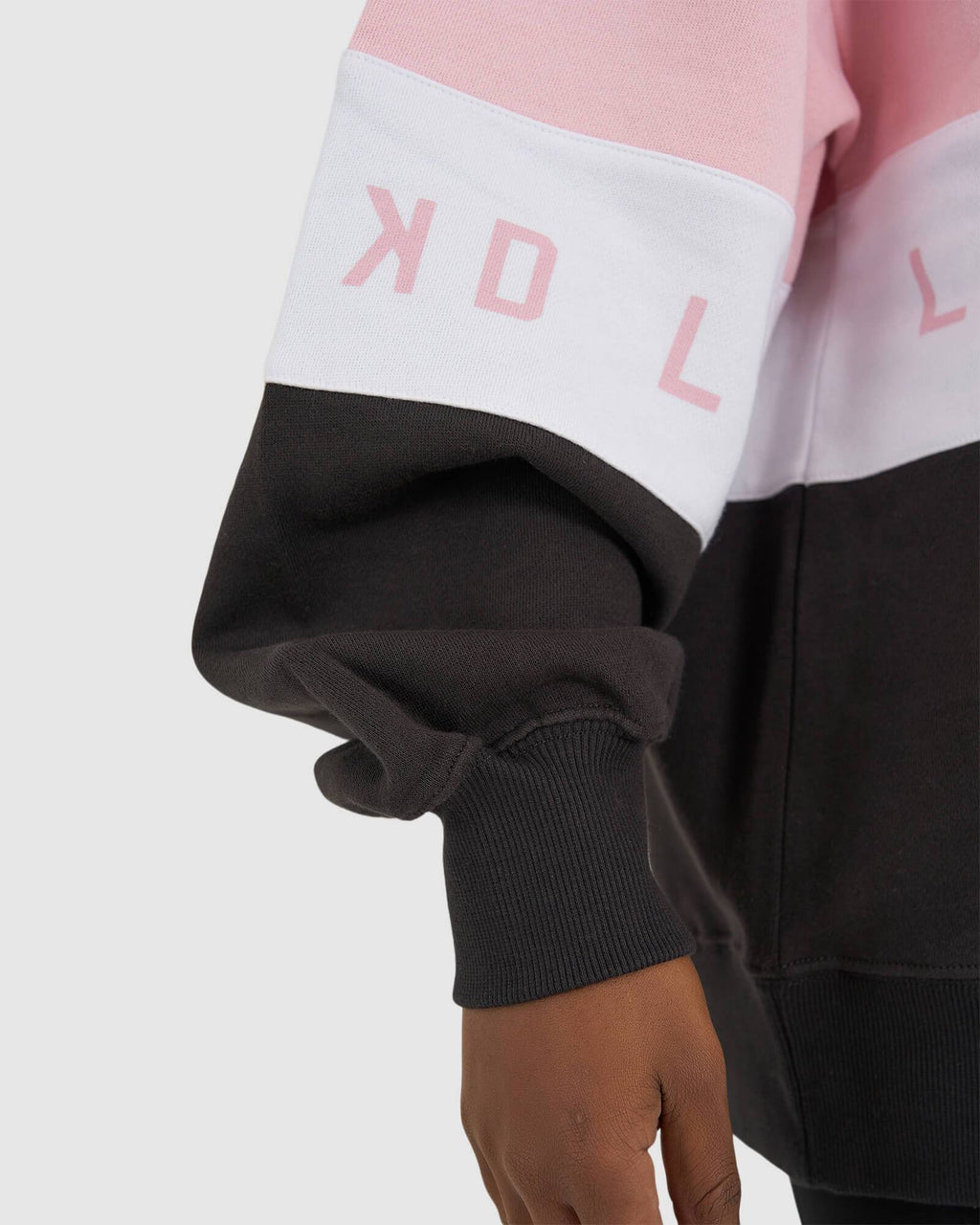 Model wearing Disc Sweater Oversize - Petal Pink