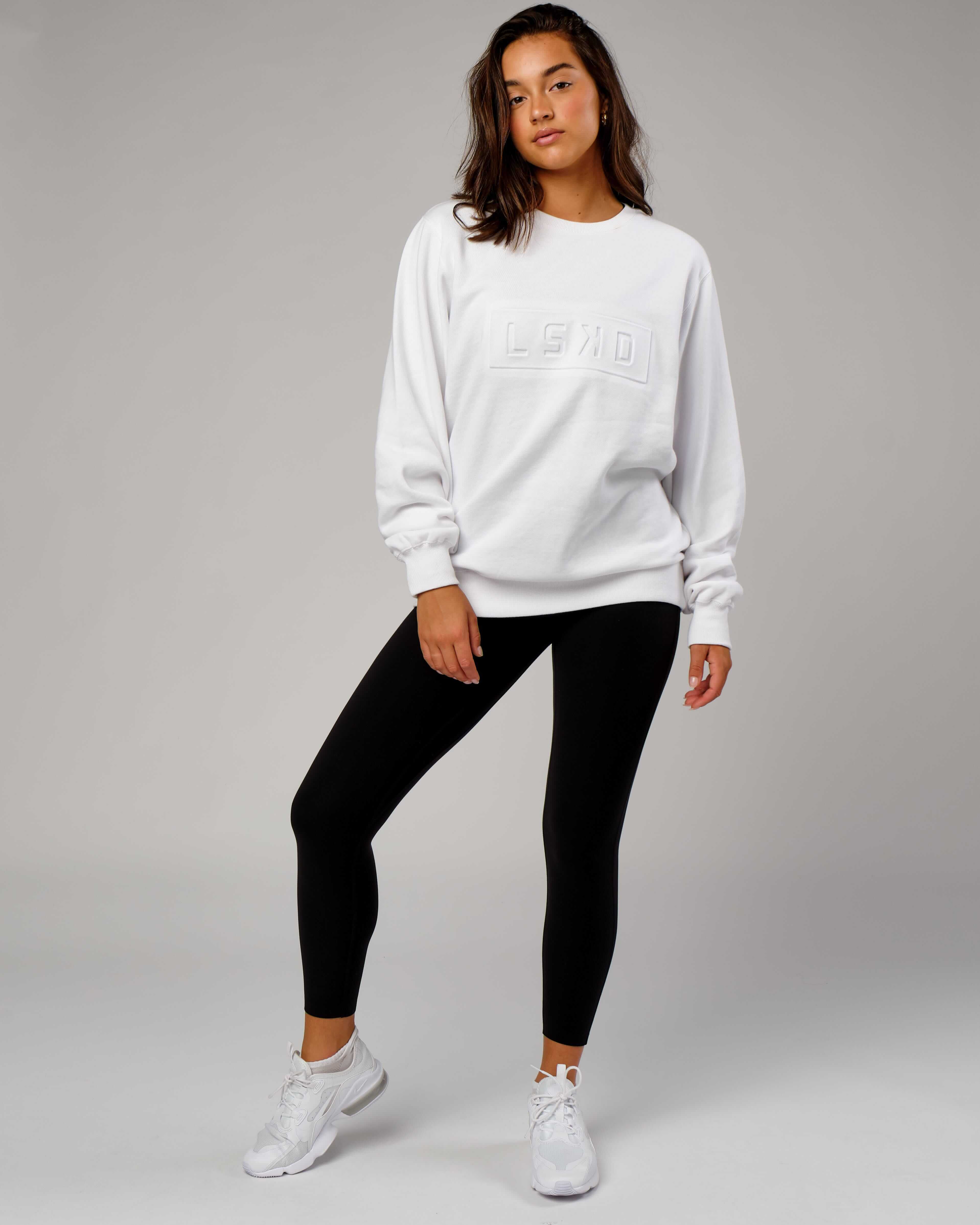 Model wearing Unisex Imprint Sweater - White